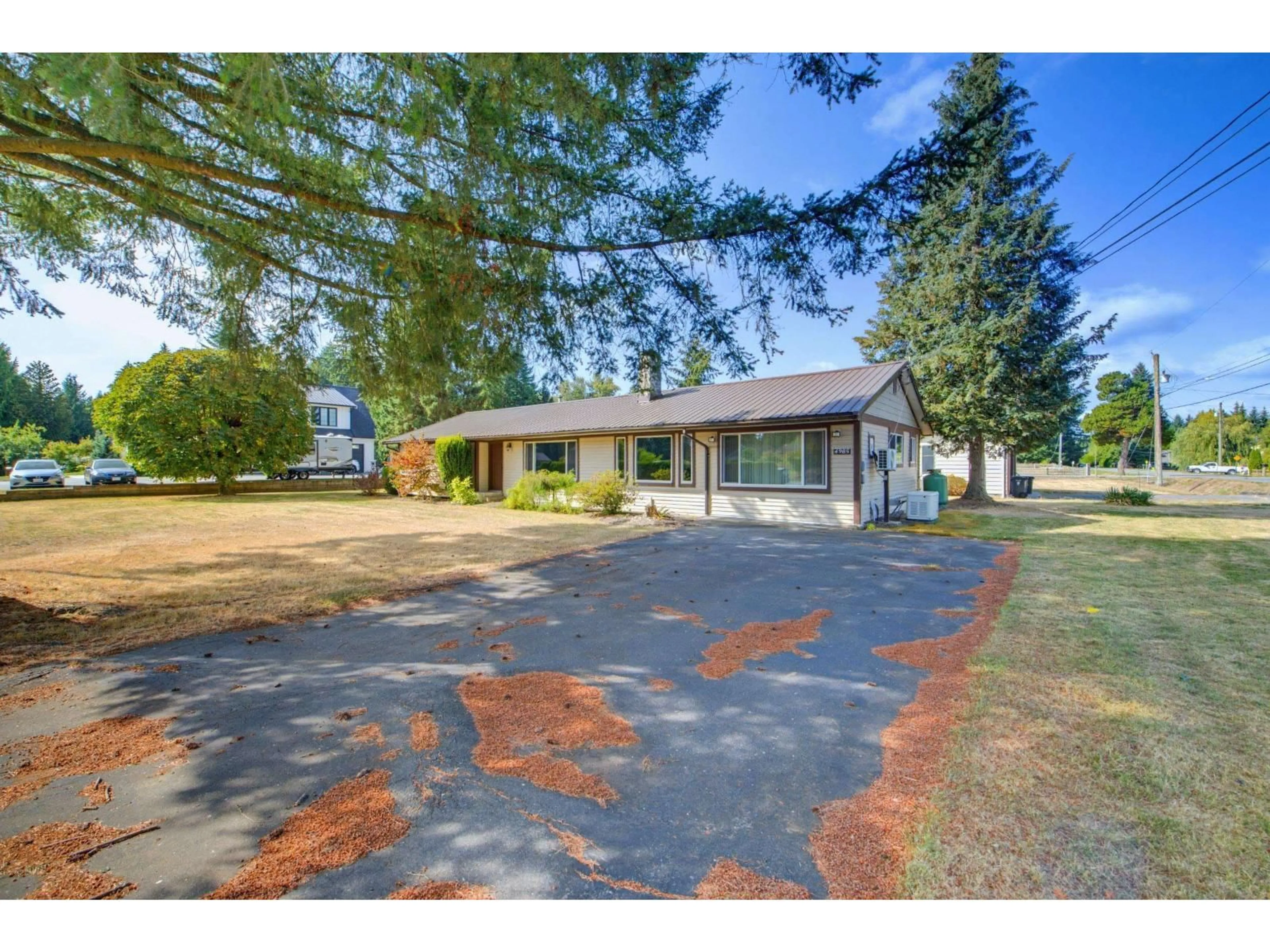 A pic from outside/outdoor area/front of a property/back of a property/a pic from drone, street for 4985 246A STREET, Langley British Columbia V2Z1J1