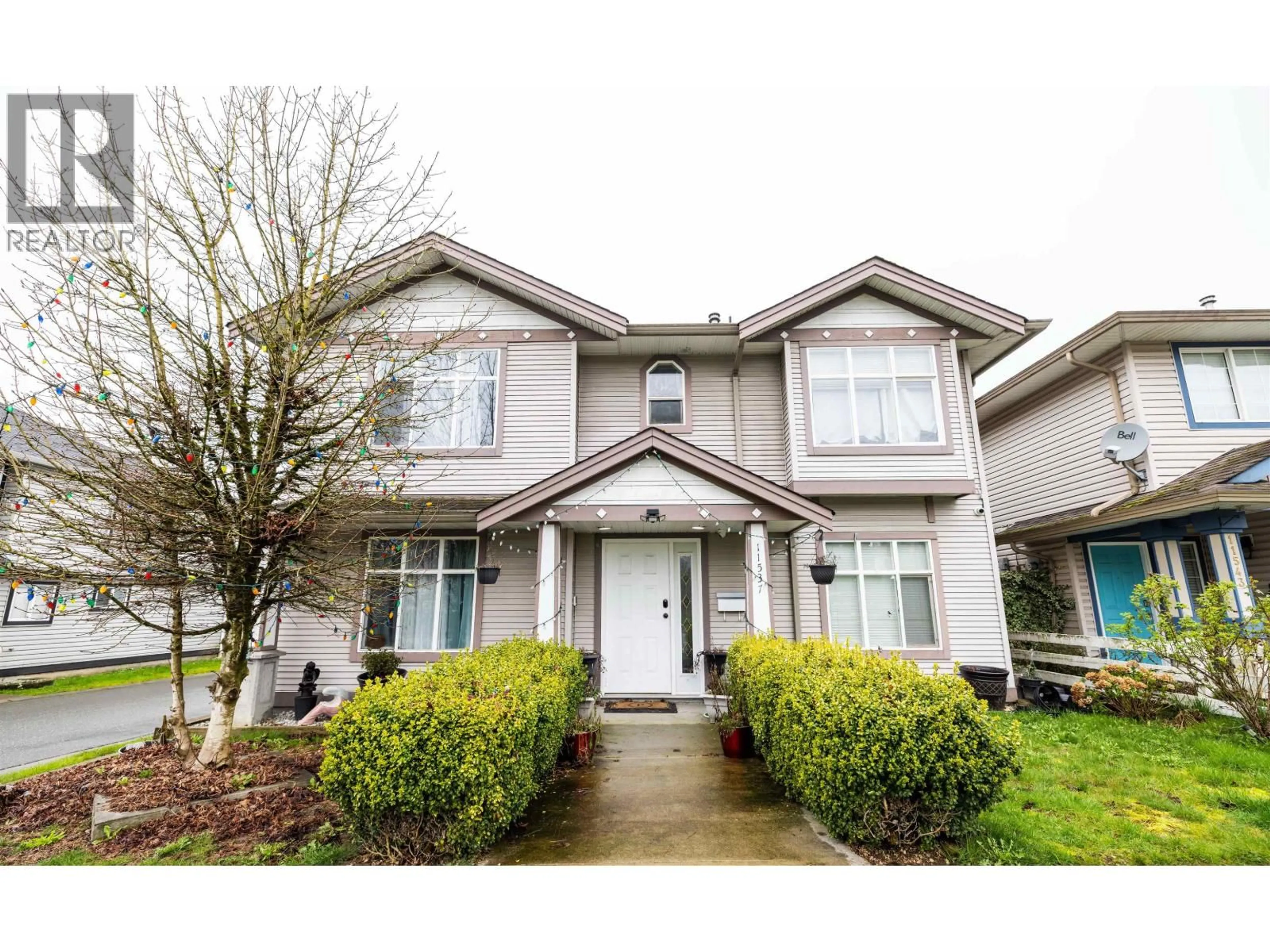 Home with vinyl exterior material, street for 11537 240 STREET, Maple Ridge British Columbia V2W1A3