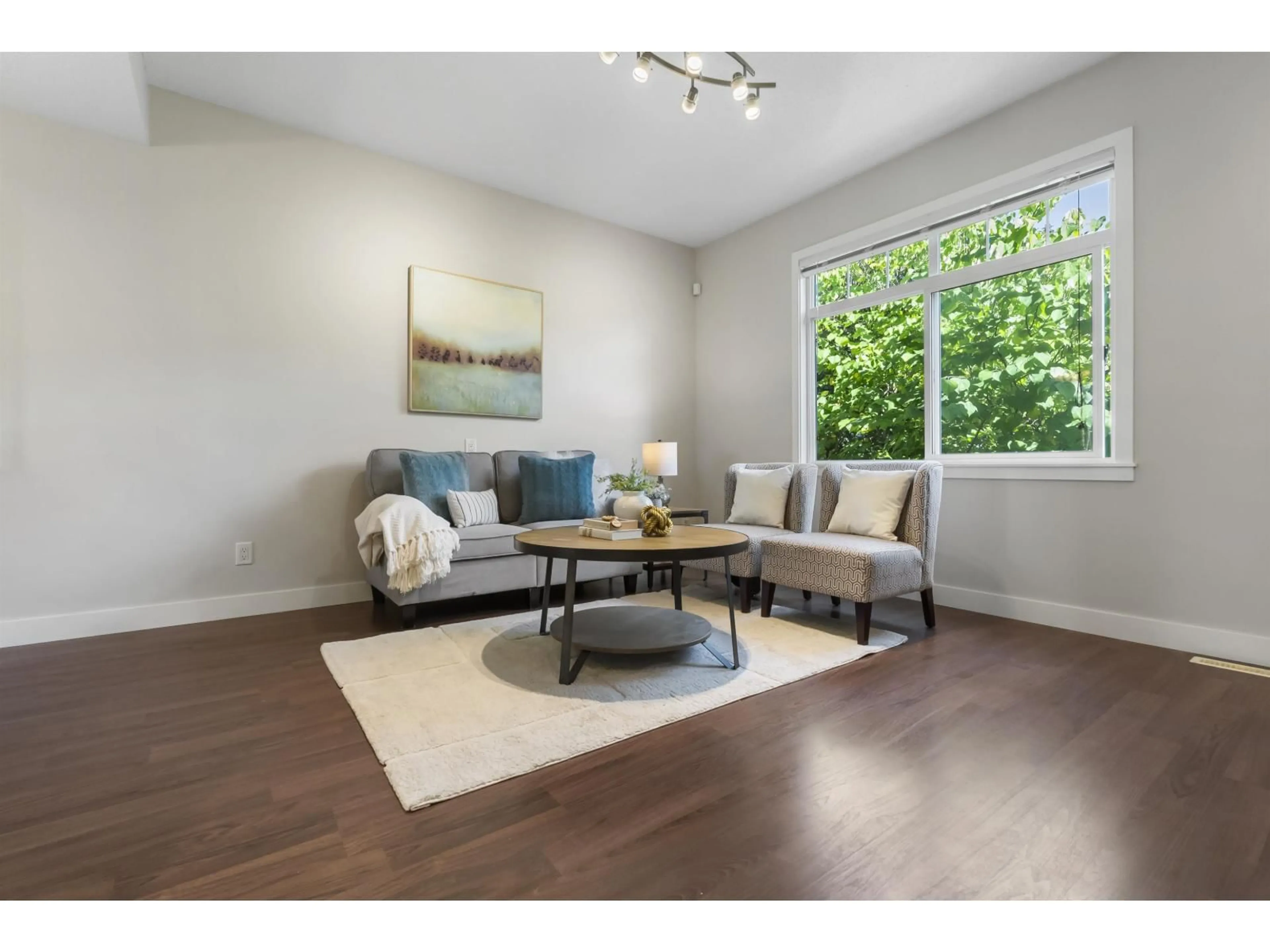 Living room with furniture, wood/laminate floor for 88 - 19551 66 AVENUE, Surrey British Columbia V4N0Z5