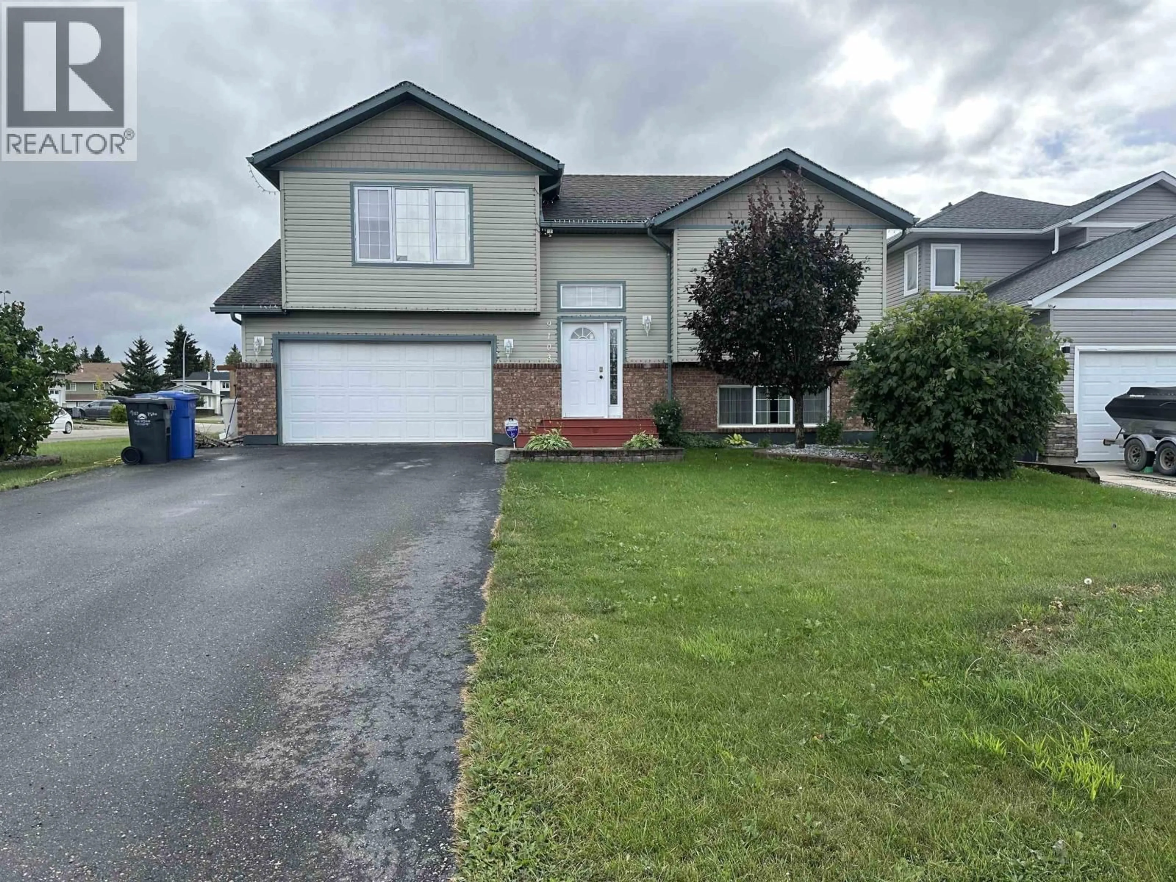 Home with vinyl exterior material, street for 9103 118 AVENUE, Fort St. John British Columbia V1J7J4
