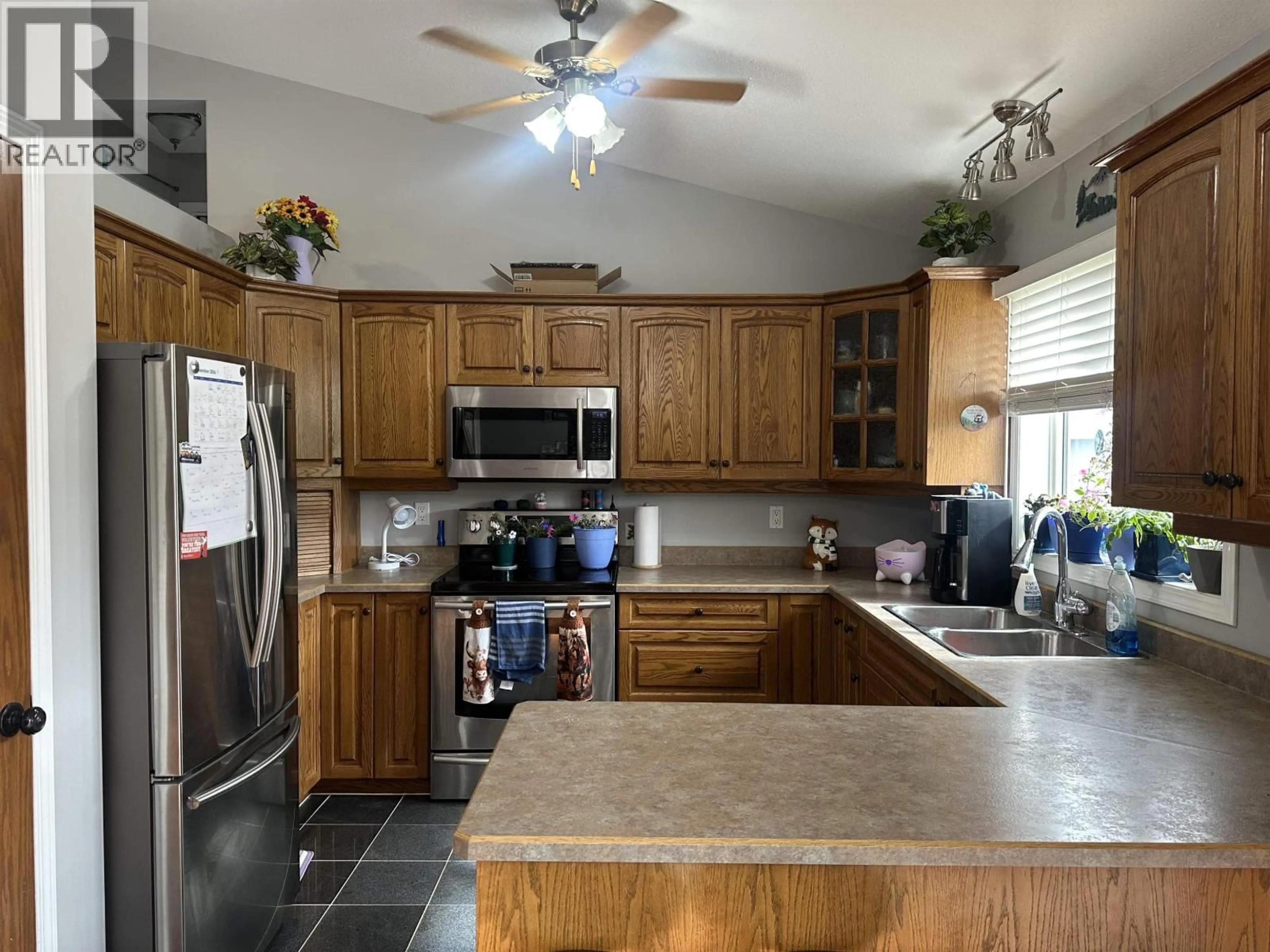 Open concept kitchen, ceramic/tile floor for 9103 118 AVENUE, Fort St. John British Columbia V1J7J4