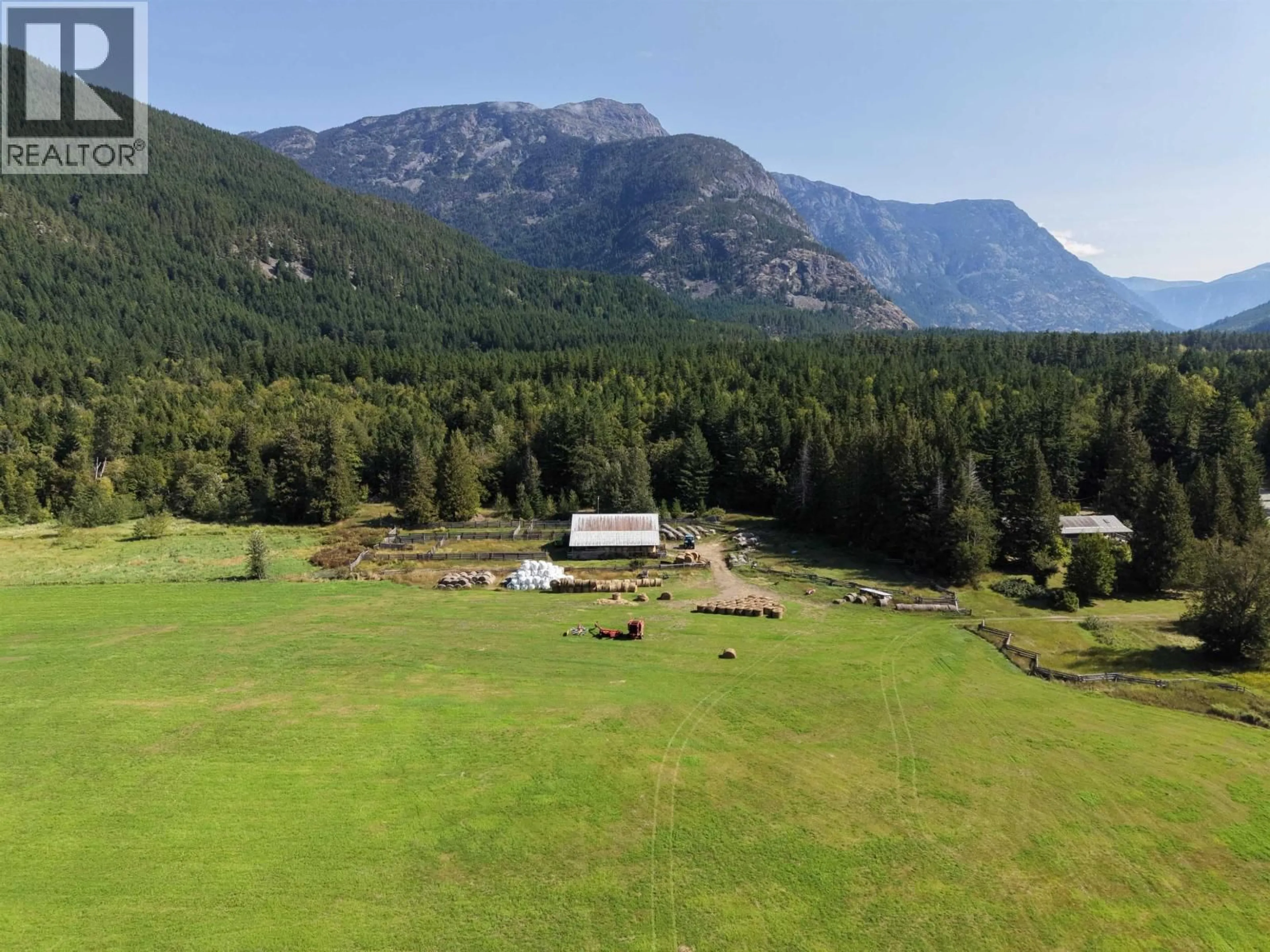 A pic from outside/outdoor area/front of a property/back of a property/a pic from drone, mountain view for SW 1/4 - 4892 MACKENZIE 20 HIGHWAY, Bella Coola British Columbia V0T1C0