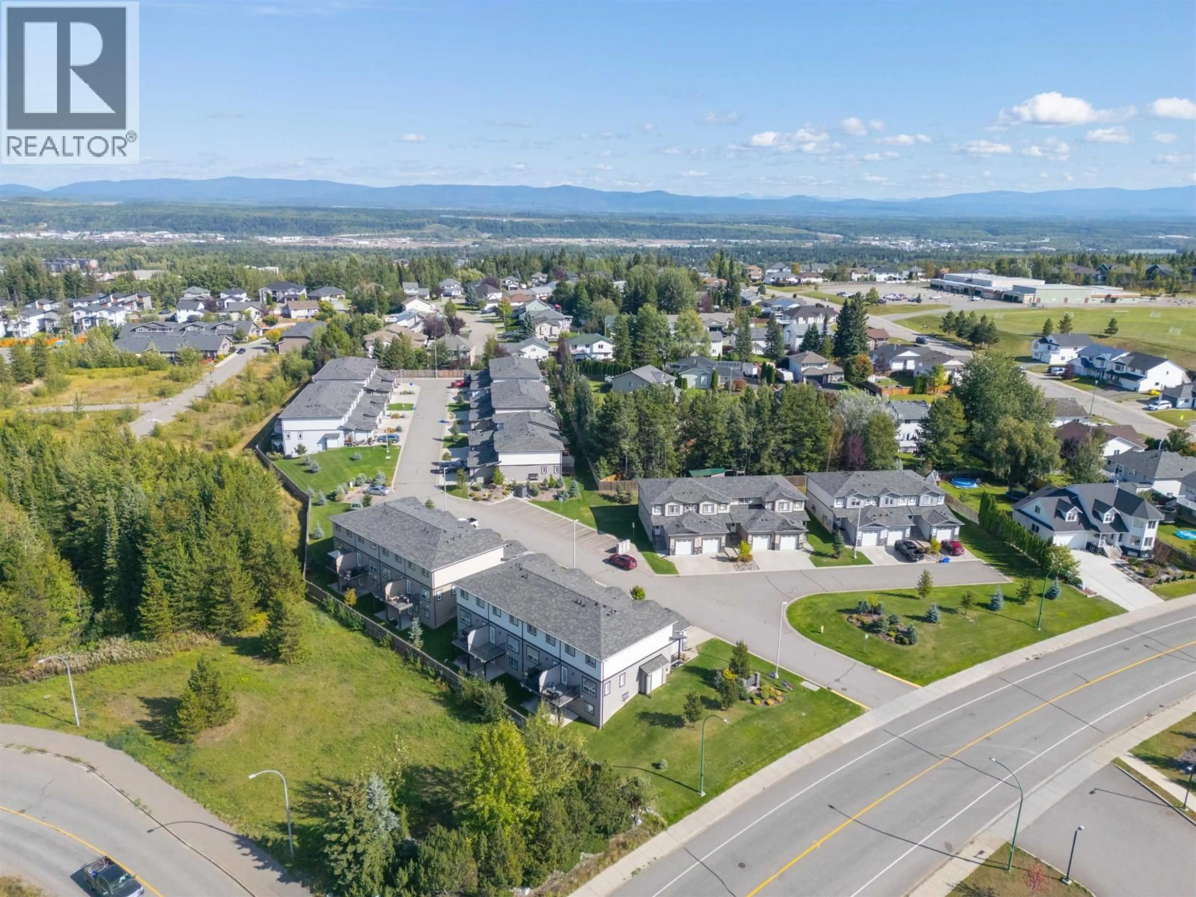 A pic from outside/outdoor area/front of a property/back of a property/a pic from drone, mountain view for 601 - 6798 WESTGATE AVENUE, Prince George British Columbia V2N0H6