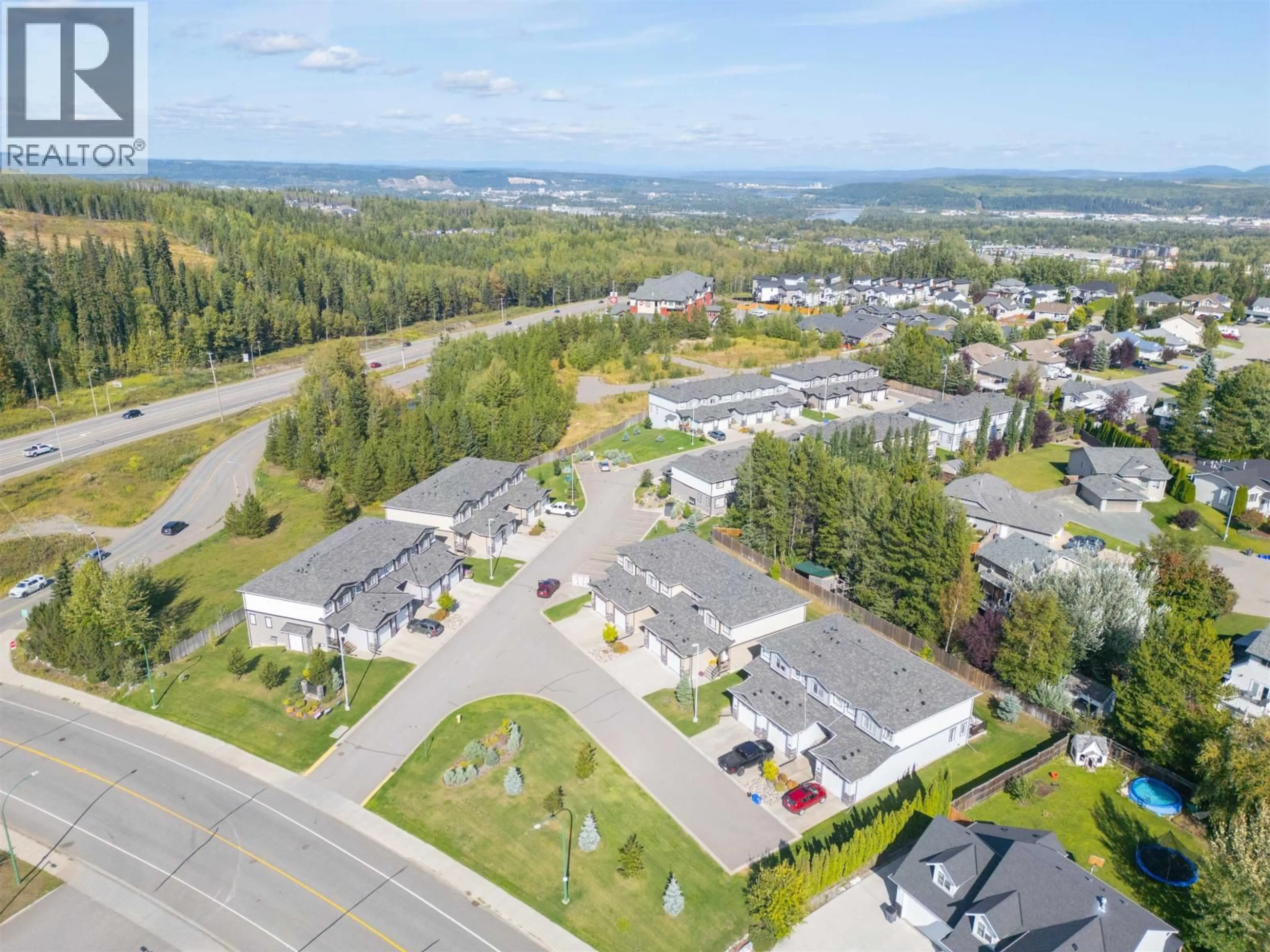 A pic from outside/outdoor area/front of a property/back of a property/a pic from drone, mountain view for 601 - 6798 WESTGATE AVENUE, Prince George British Columbia V2N0H6