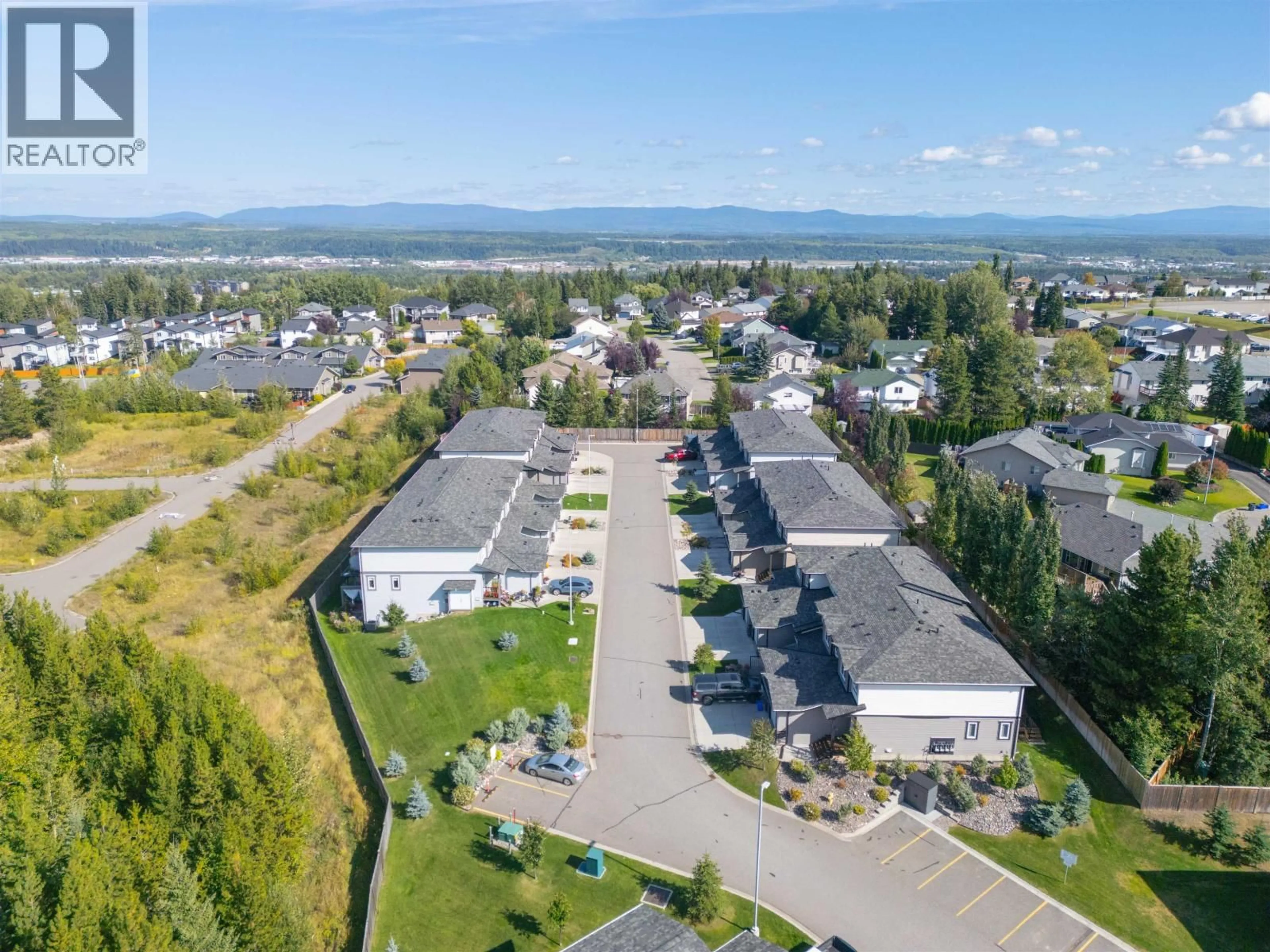 A pic from outside/outdoor area/front of a property/back of a property/a pic from drone, mountain view for 601 - 6798 WESTGATE AVENUE, Prince George British Columbia V2N0H6