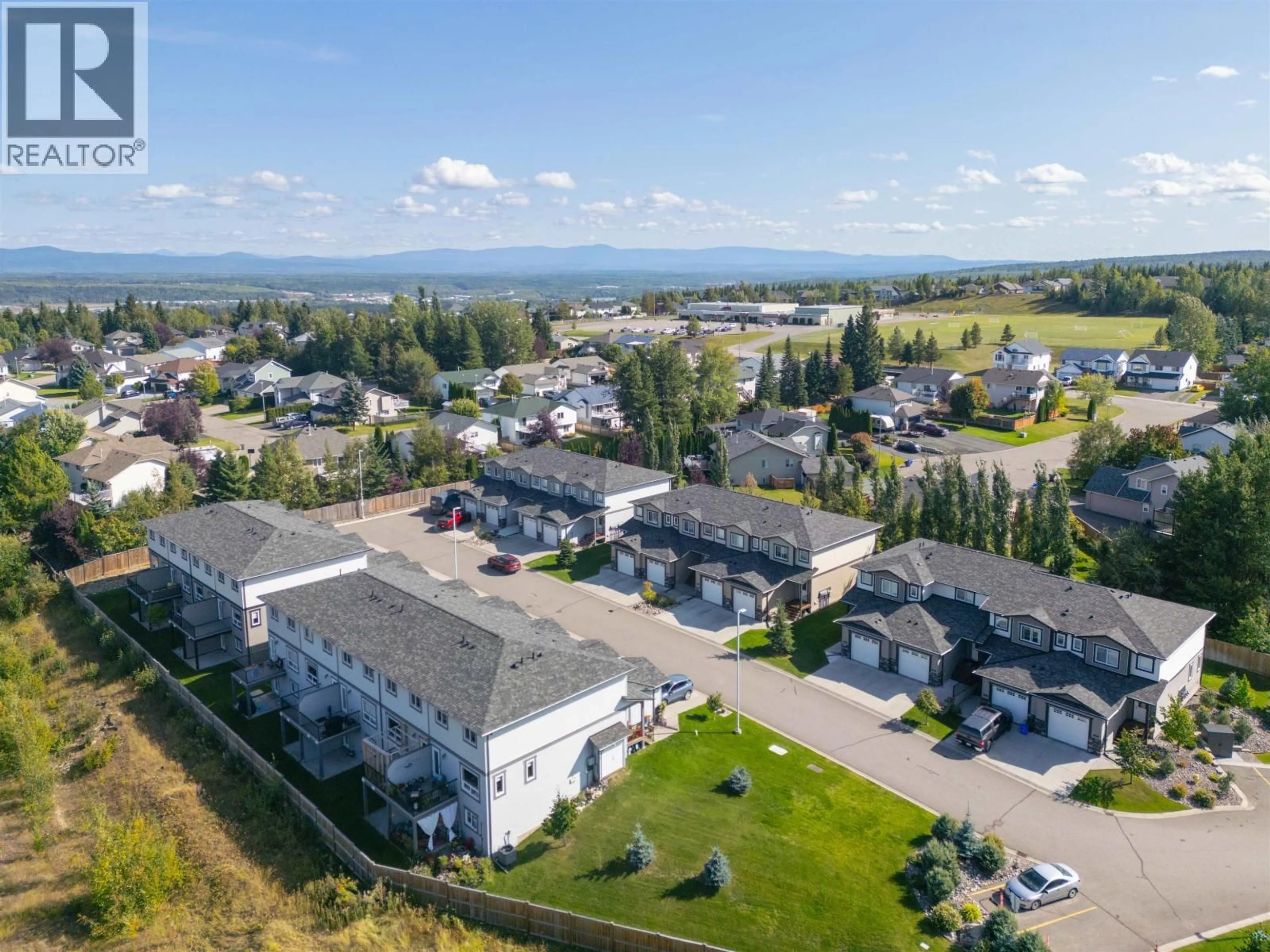A pic from outside/outdoor area/front of a property/back of a property/a pic from drone, mountain view for 601 - 6798 WESTGATE AVENUE, Prince George British Columbia V2N0H6