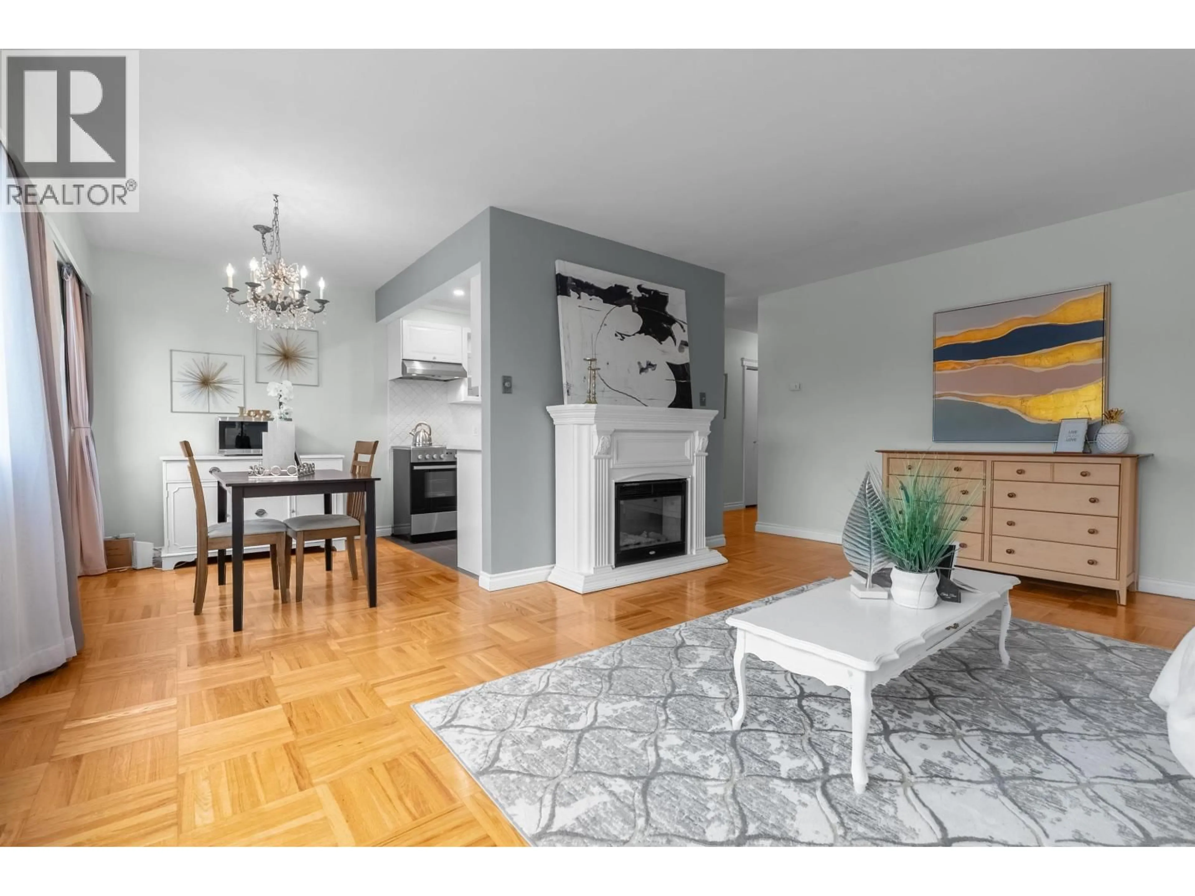 Living room with furniture, wood/laminate floor for 402 - 1750 ESQUIMALT AVENUE, West Vancouver British Columbia V7V1R8