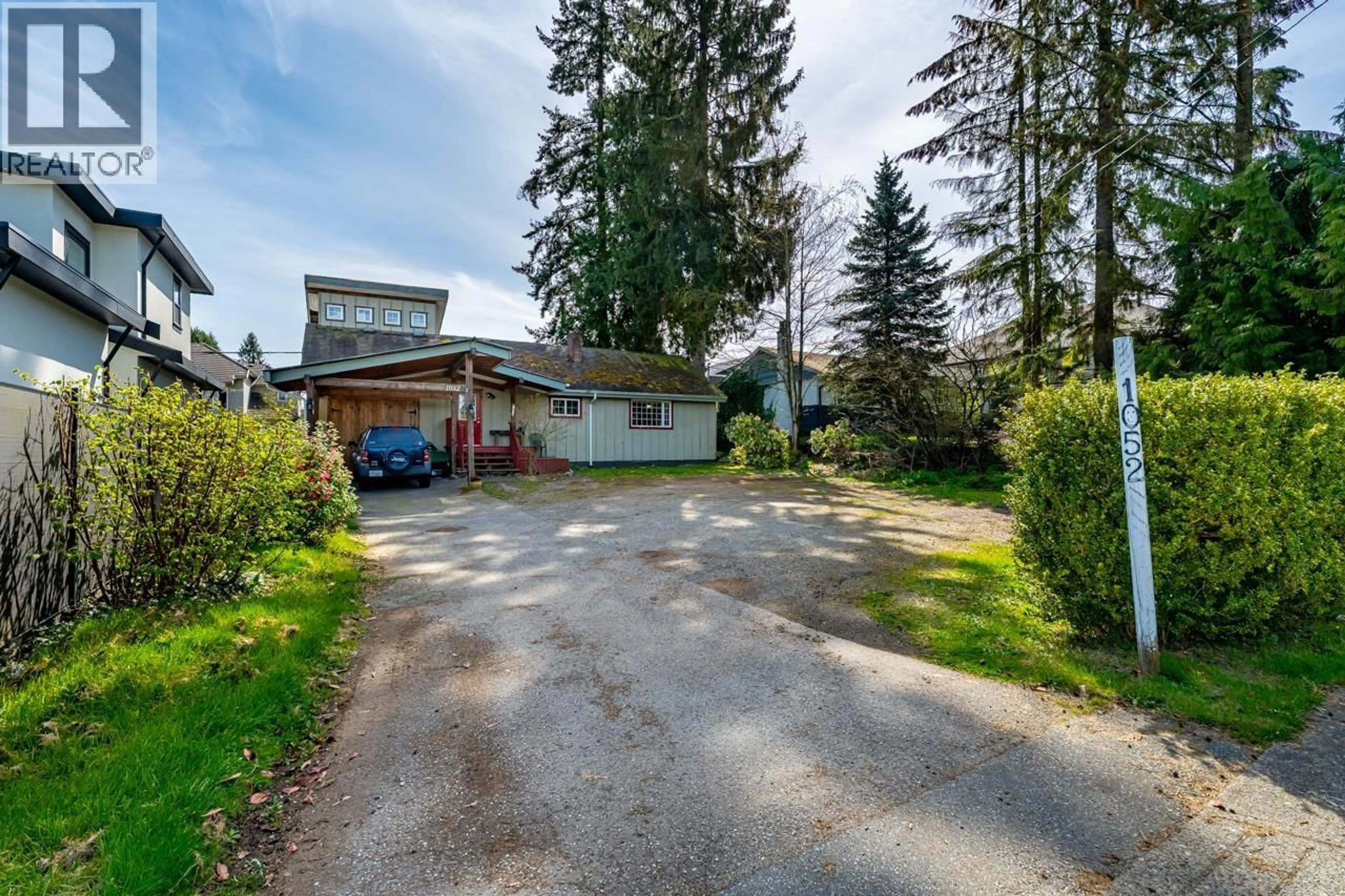 A pic from outside/outdoor area/front of a property/back of a property/a pic from drone, street for 1052 COMO LAKE AVENUE, Coquitlam British Columbia V3J3N8