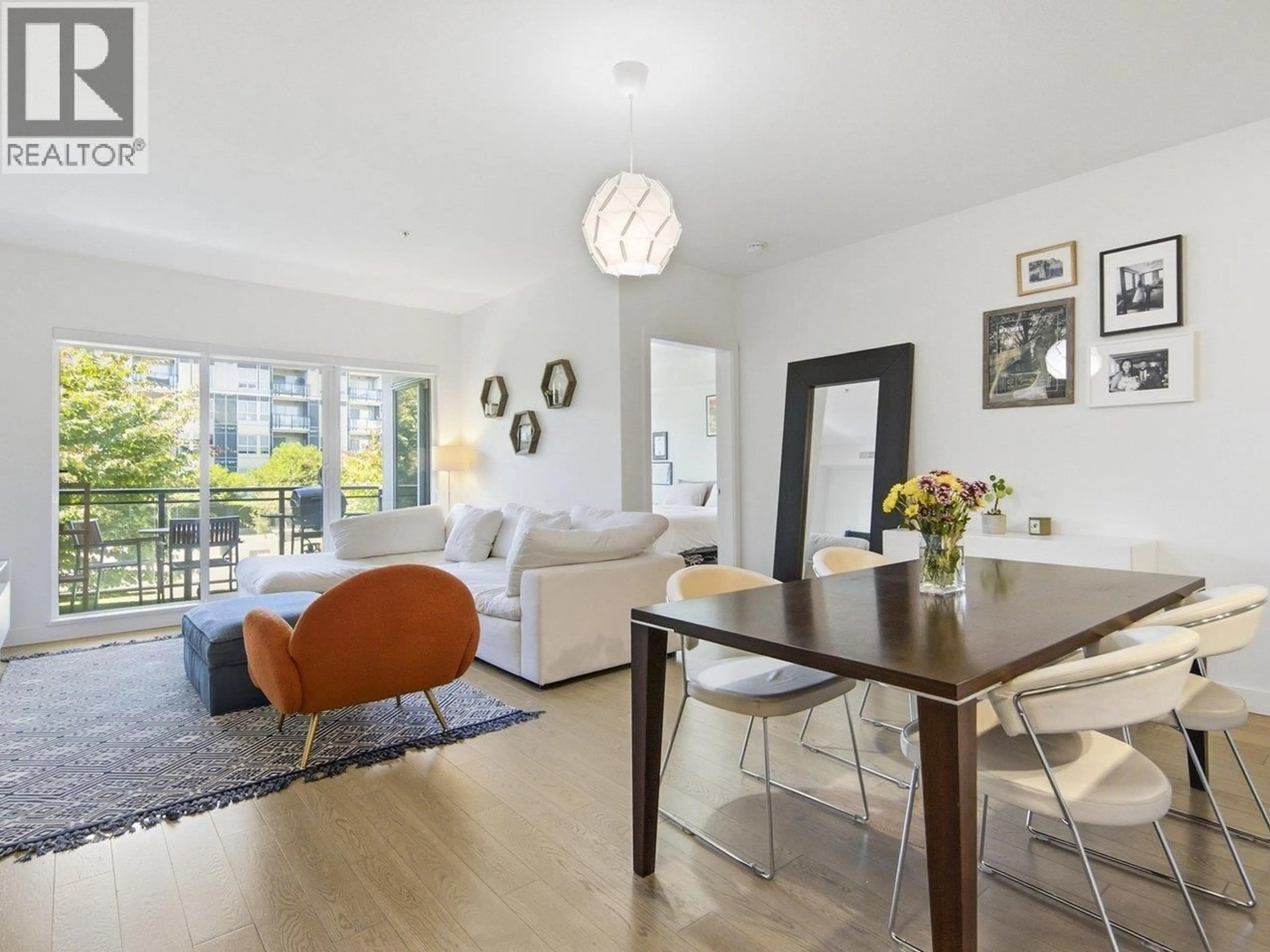 Living room with furniture, wood/laminate floor for 210 - 10177 RIVER DRIVE, Richmond British Columbia V6X0S2