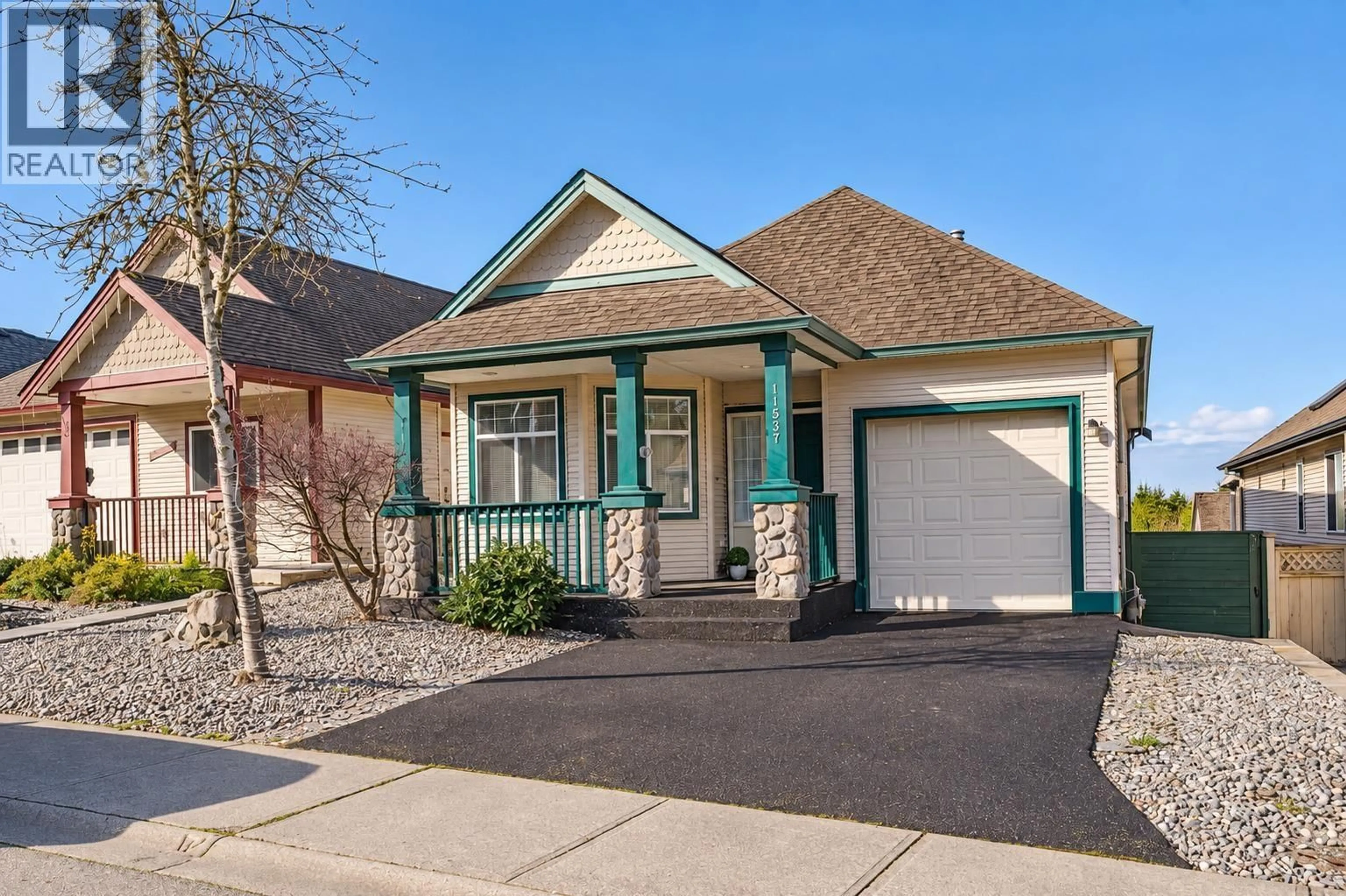 Home with vinyl exterior material, street for 11537 228 STREET, Maple Ridge British Columbia V2X3N6