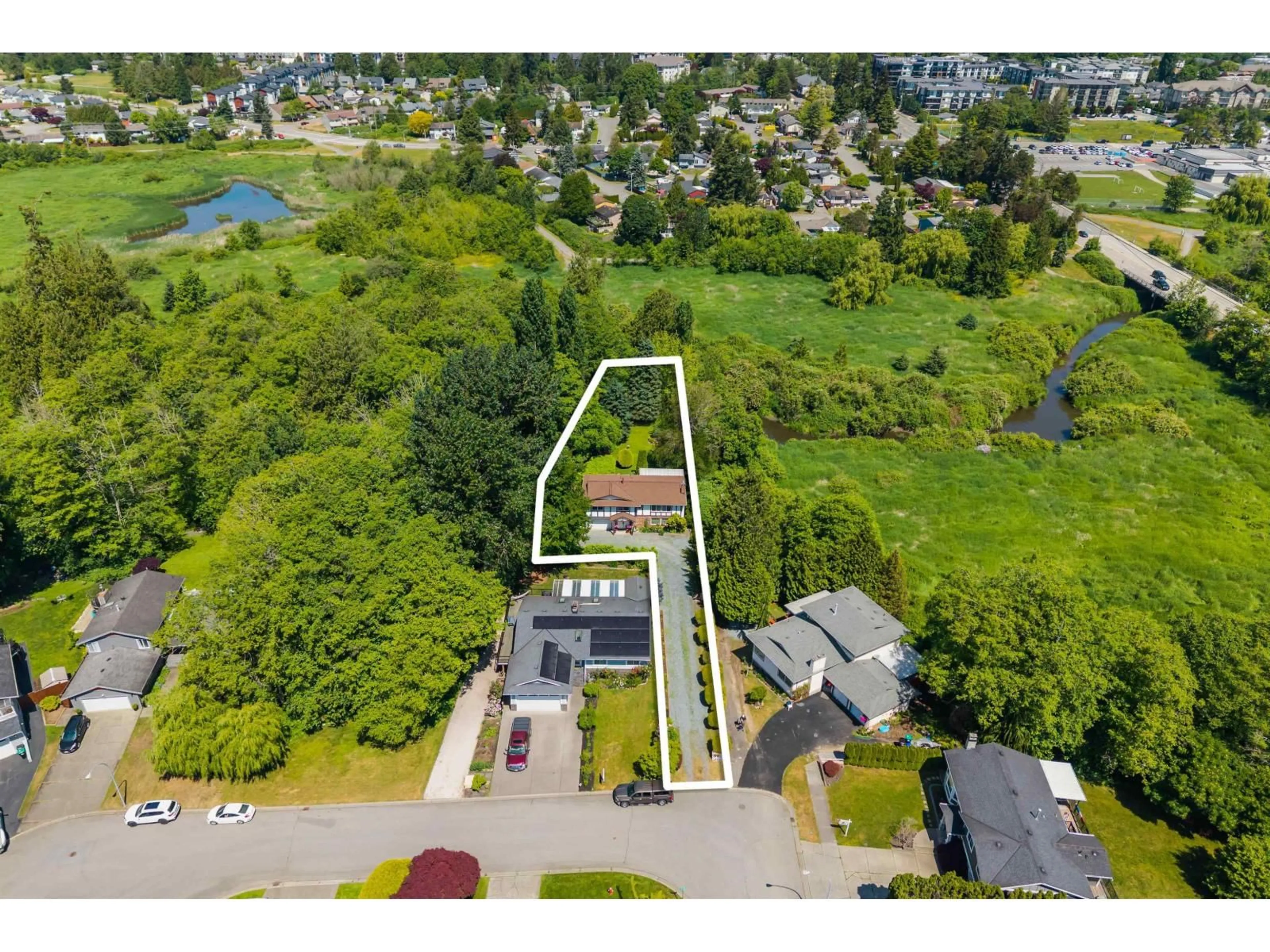 A pic from outside/outdoor area/front of a property/back of a property/a pic from drone, street for 19949 51 AVENUE, Langley British Columbia V3A7P2