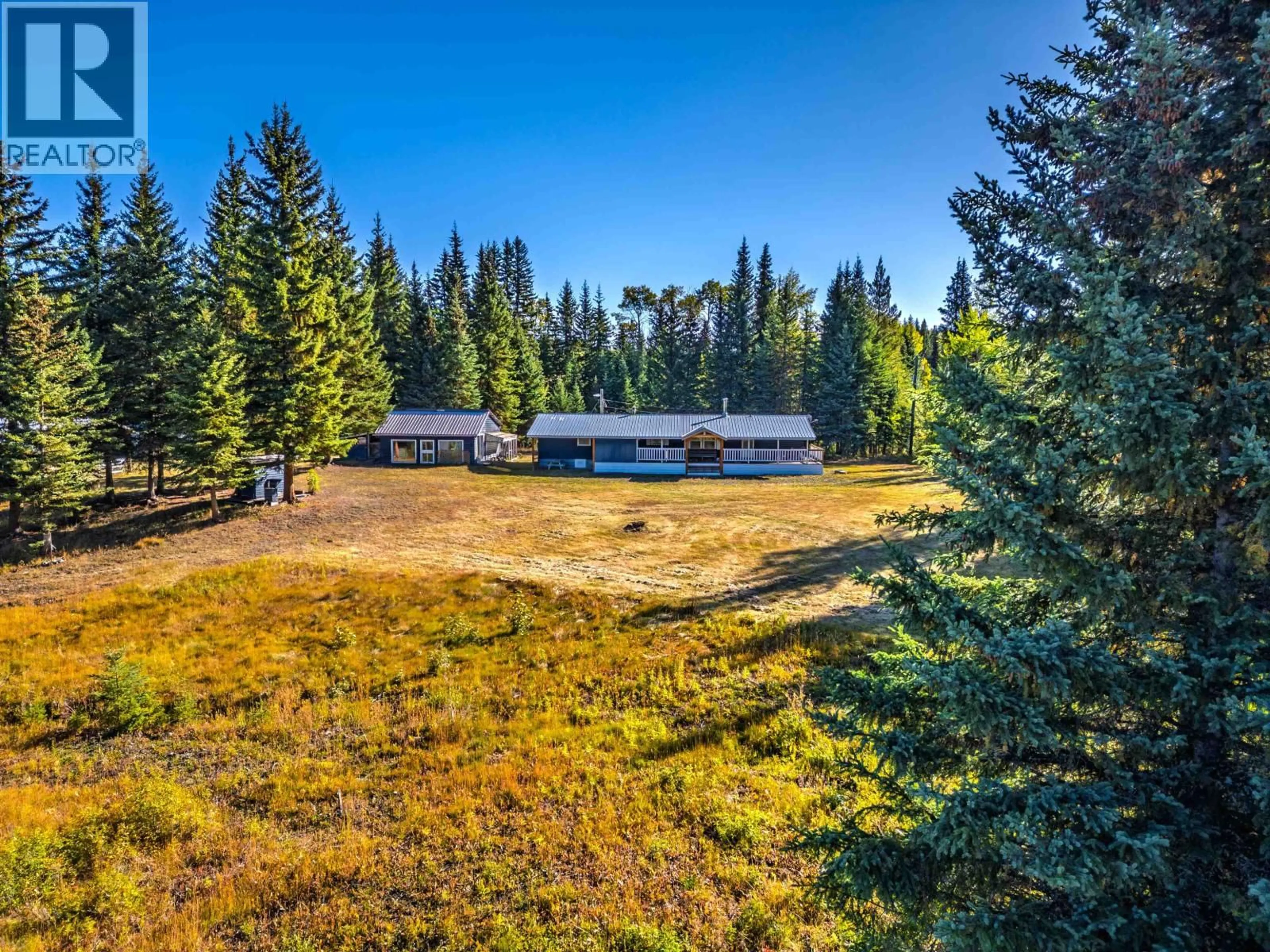 A pic from outside/outdoor area/front of a property/back of a property/a pic from drone, forest/trees view for 7778 MACHETE LAKE ROAD, Bridge Lake British Columbia V0K1E0