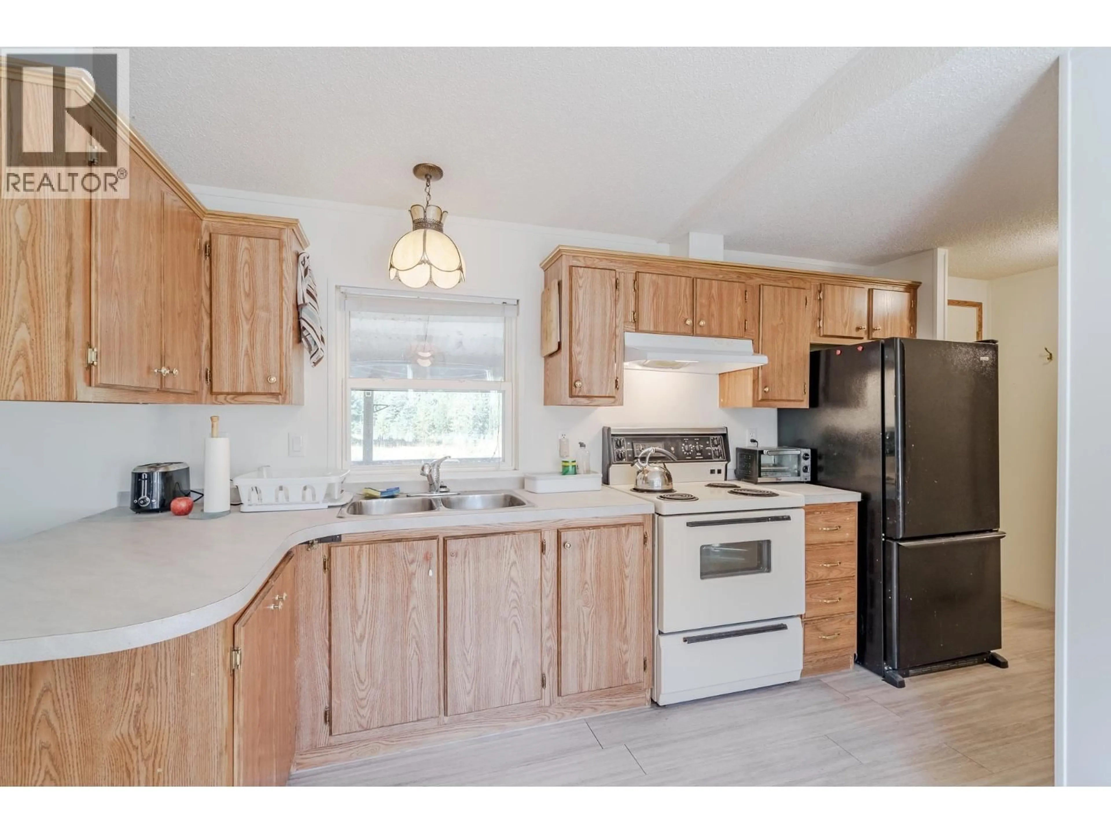 Standard kitchen, unknown for 7778 MACHETE LAKE ROAD, Bridge Lake British Columbia V0K1E0