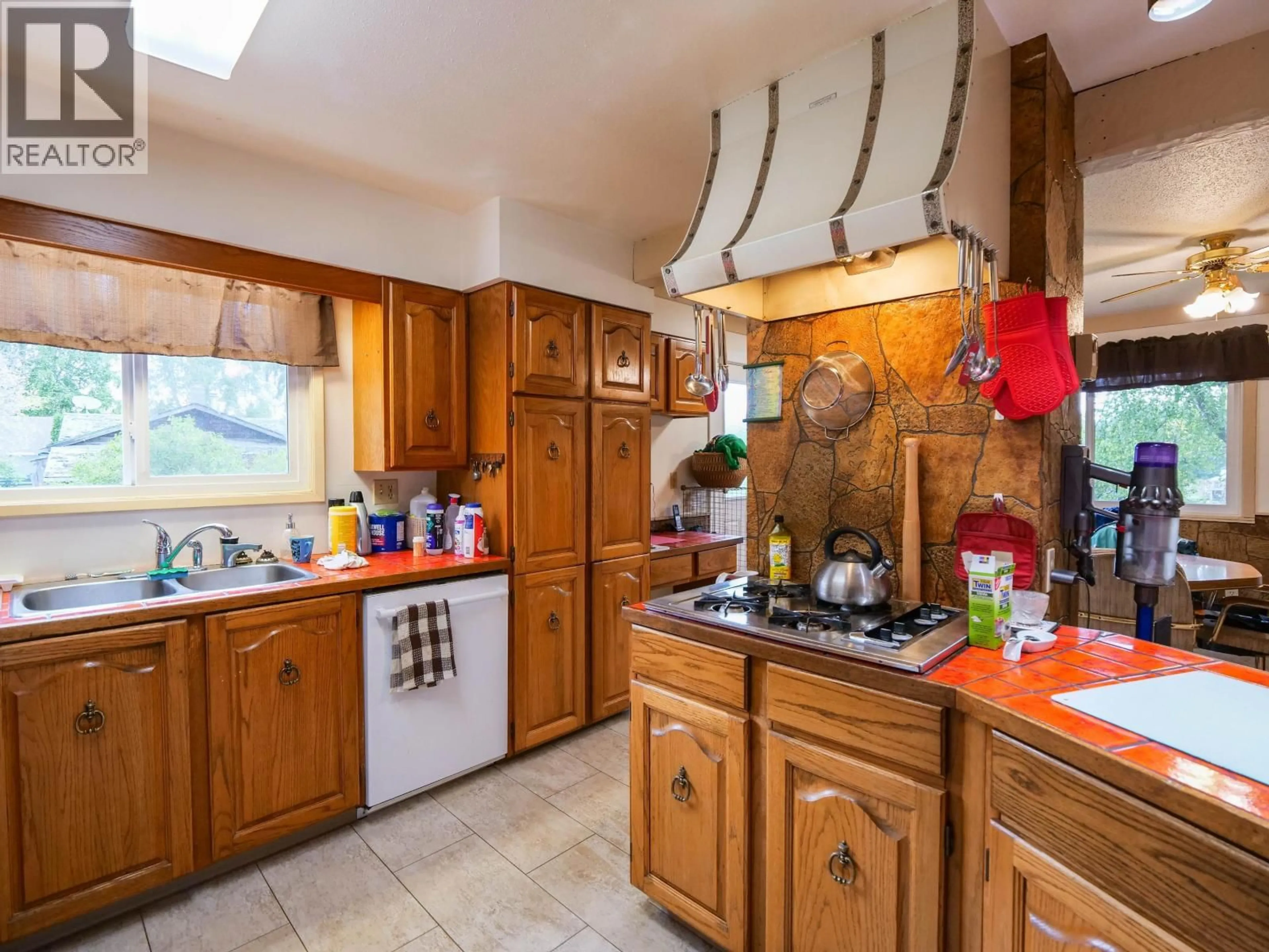 Standard kitchen, ceramic/tile floor for 785 NORTH FRASER DRIVE, Quesnel British Columbia V2J1Z7