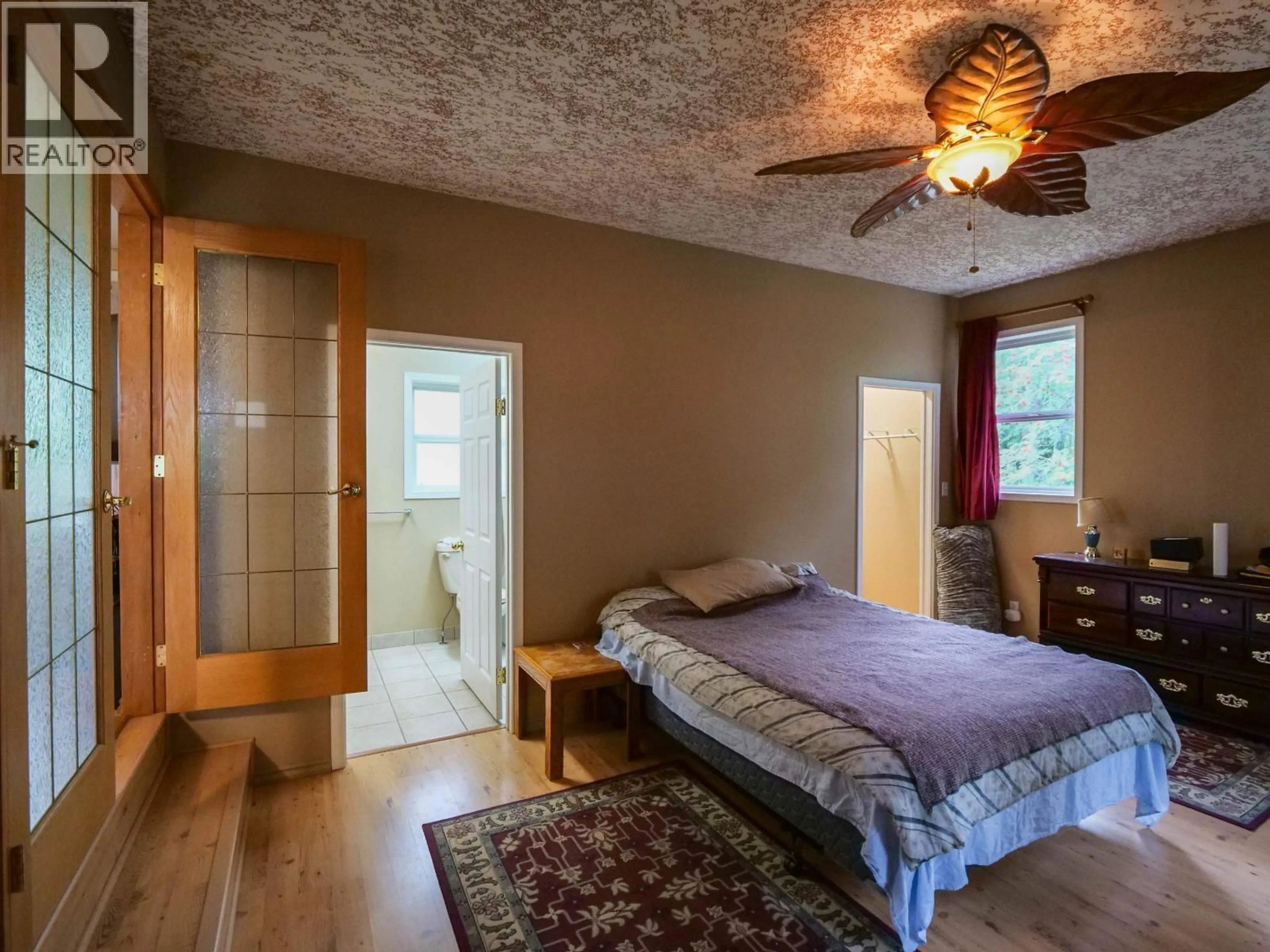 Bedroom with bed, wood/laminate floor for 785 NORTH FRASER DRIVE, Quesnel British Columbia V2J1Z7