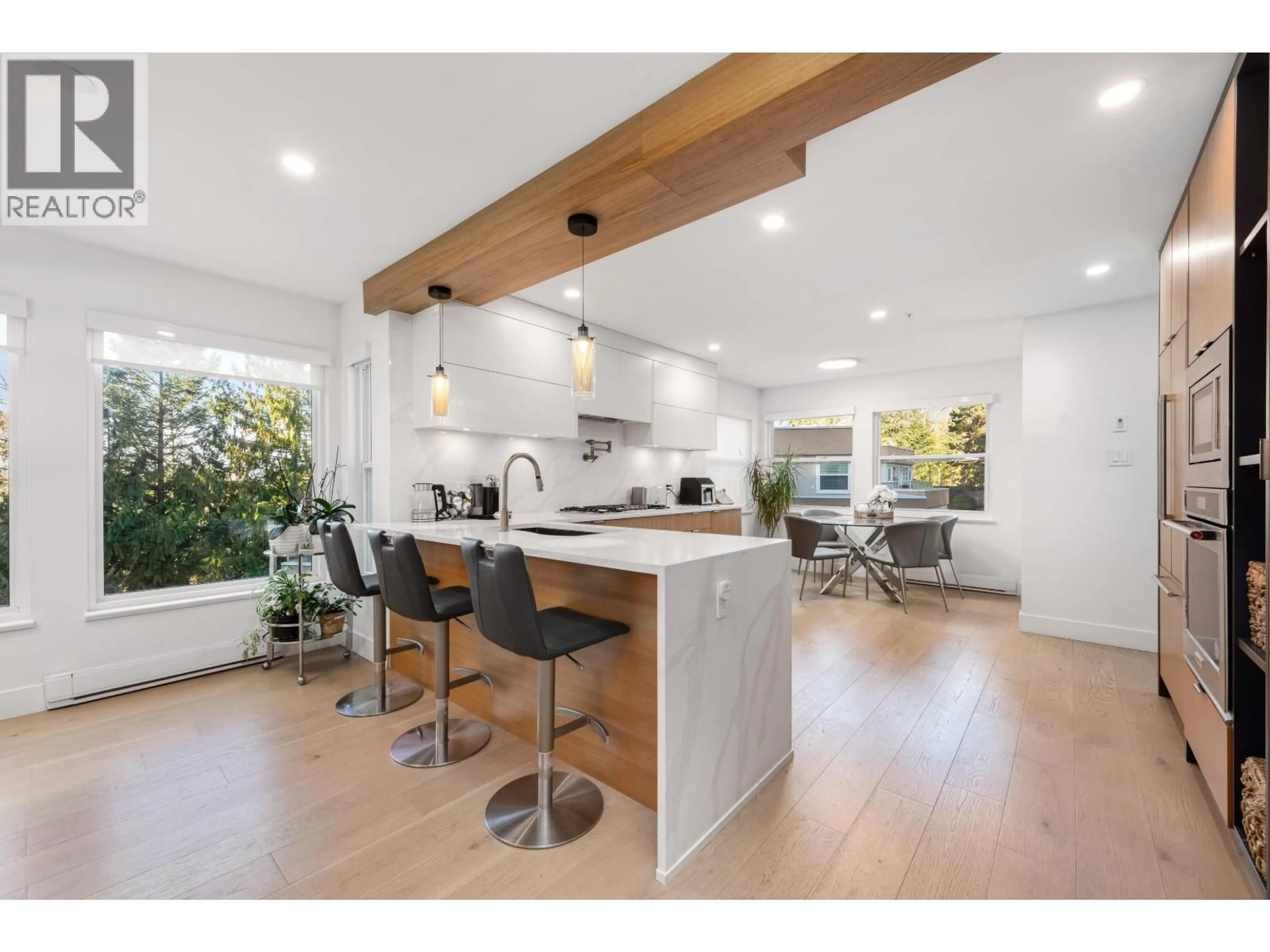 Open concept kitchen, wood/laminate floor for 11 - 2425 EDGEMONT BOULEVARD, North Vancouver British Columbia V7P2L2