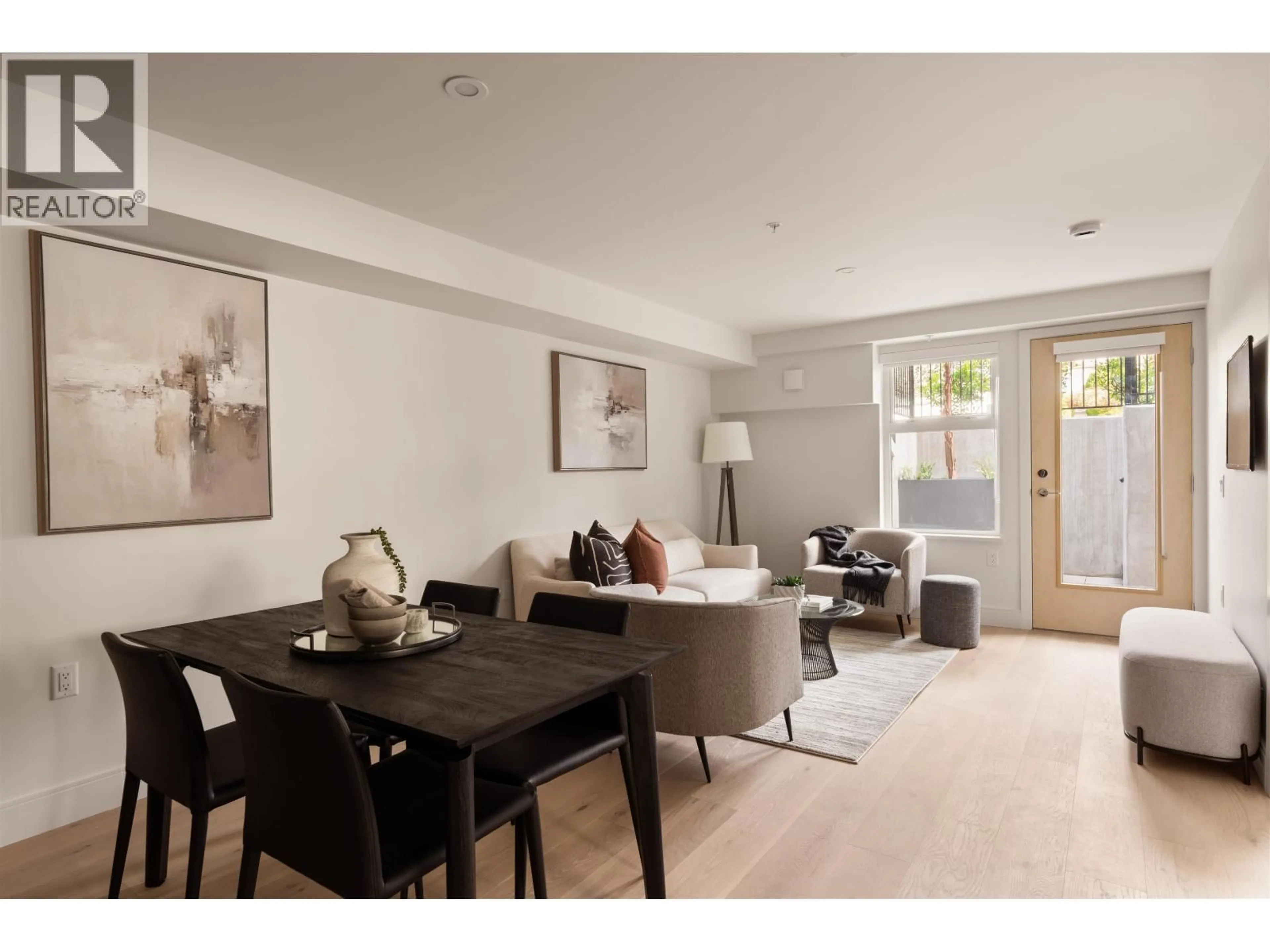 Living room with furniture, wood/laminate floor for 101 - 378 45TH AVENUE, Vancouver British Columbia V5Y0P6