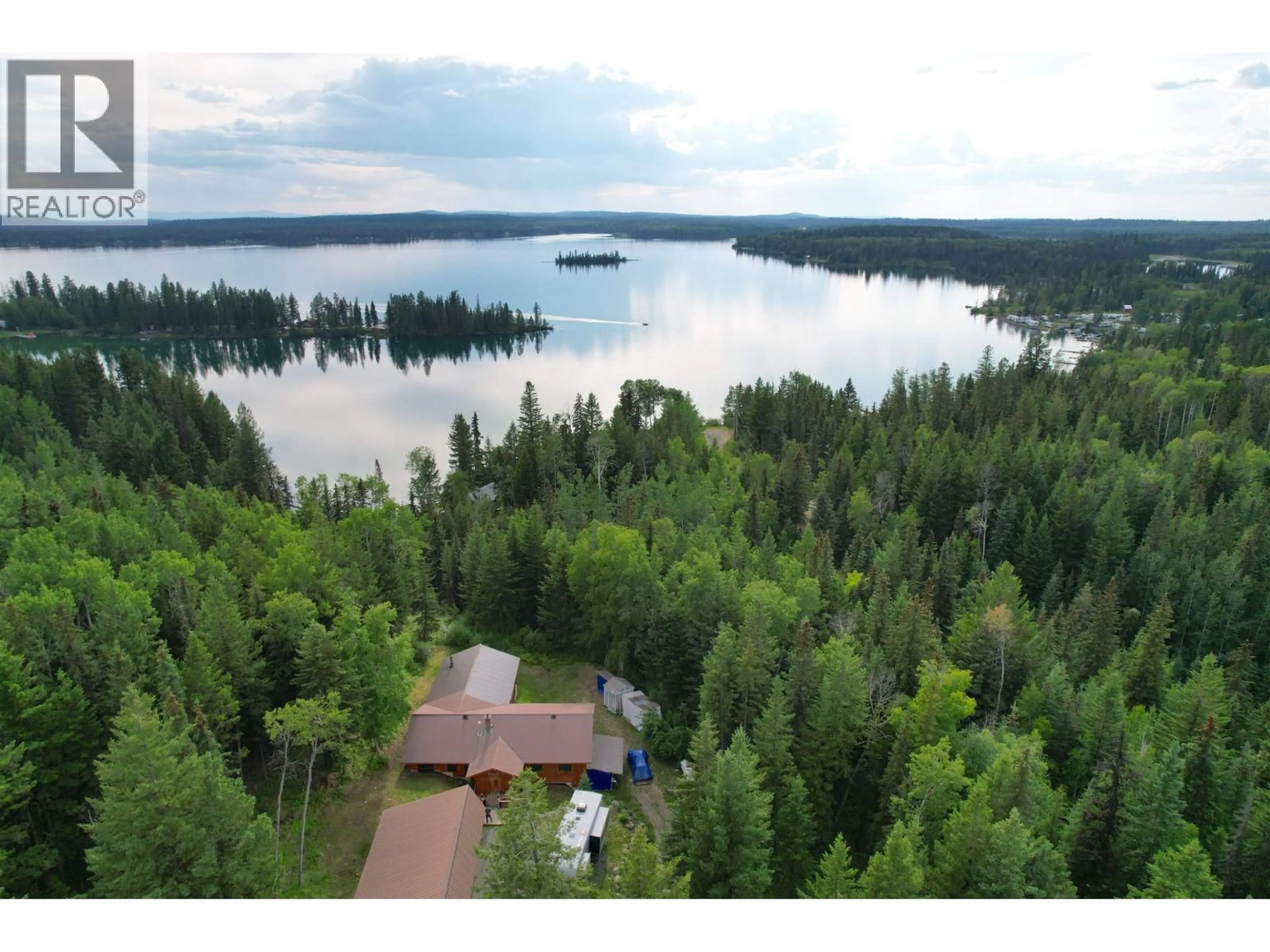 A pic from outside/outdoor area/front of a property/back of a property/a pic from drone, water/lake/river/ocean view for 7524 THOMAS POINT ROAD, 100 Mile House British Columbia V0K1X1