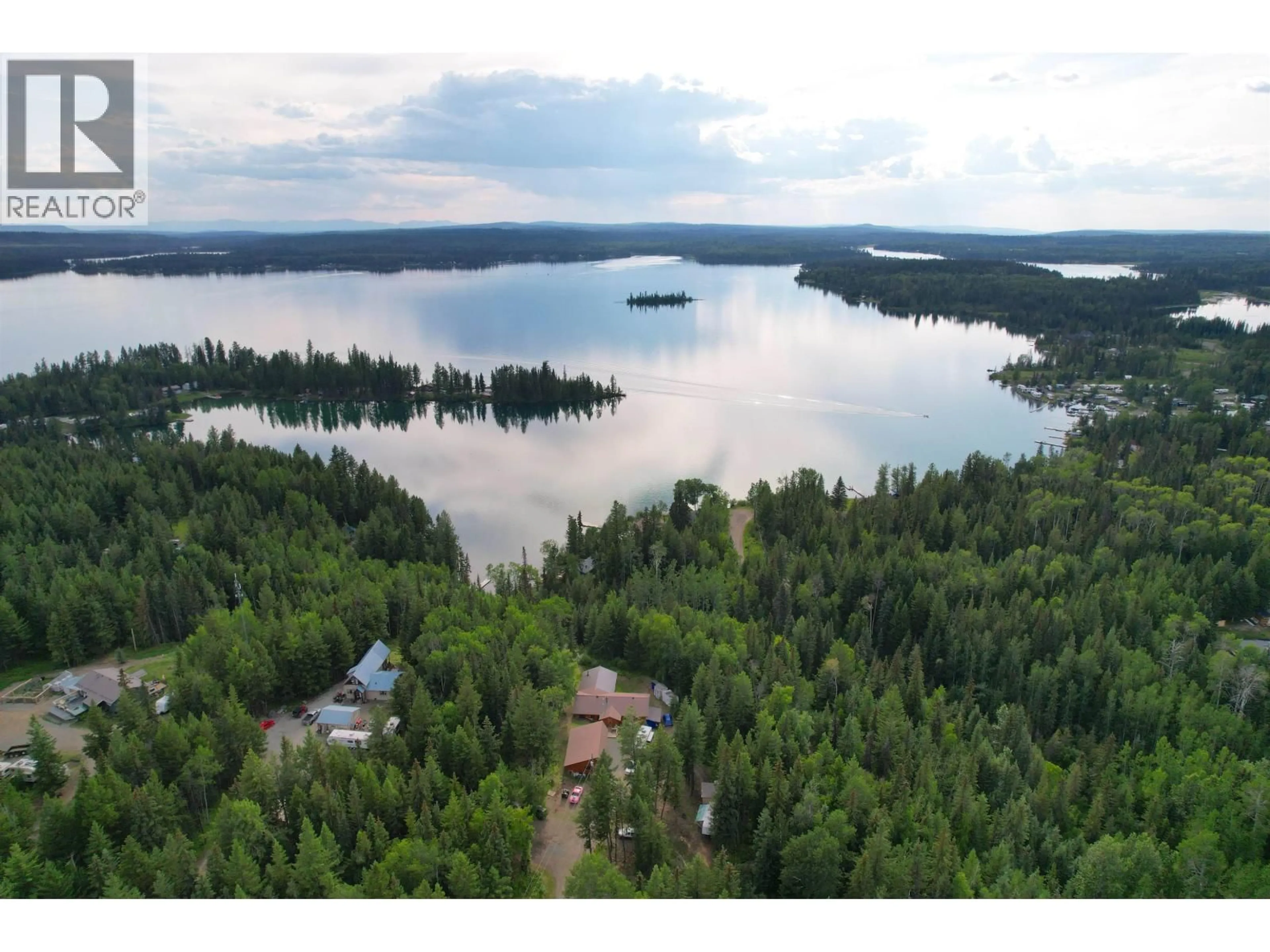 A pic from outside/outdoor area/front of a property/back of a property/a pic from drone, water/lake/river/ocean view for 7524 THOMAS POINT ROAD, 100 Mile House British Columbia V0K1X1