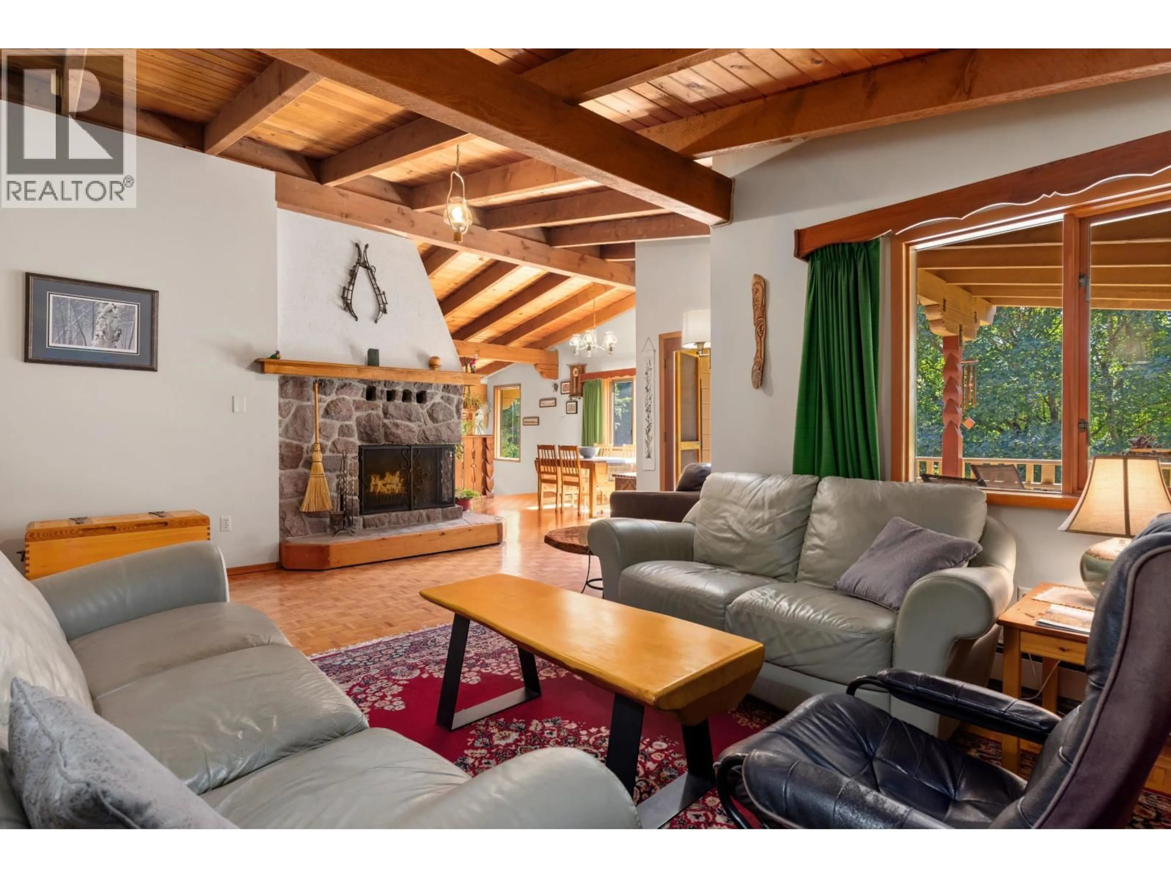 Living room with furniture, wood/laminate floor for 7869 PEMBERTON MEADOWS ROAD, Pemberton British Columbia V0N2L2