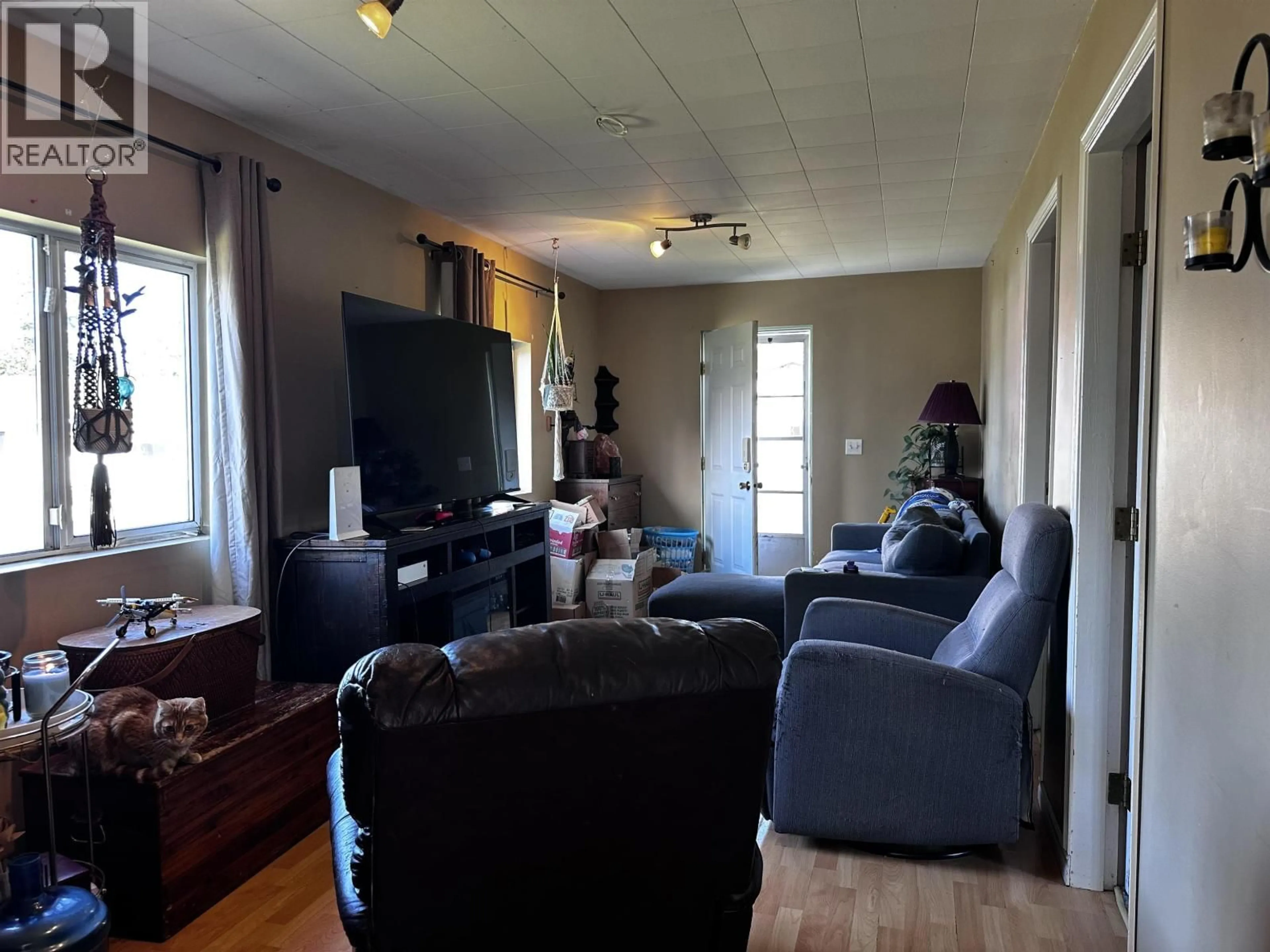Living room with furniture, wood/laminate floor for 3965 FELKER STREET, Lac La Hache British Columbia V0K1T0