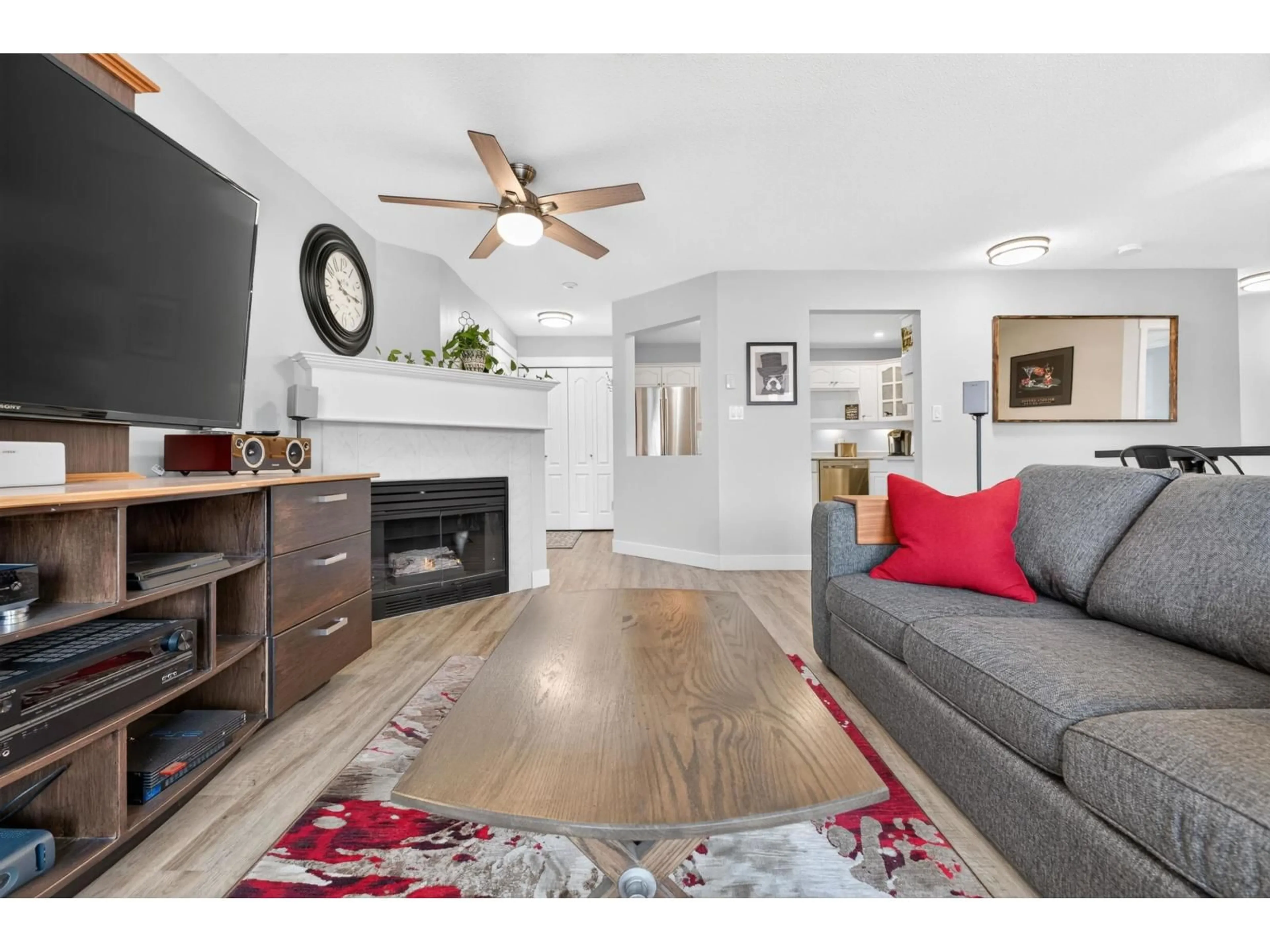 Living room with furniture, wood/laminate floor for 205 - 17730 58A AVENUE, Surrey British Columbia V3S8M5