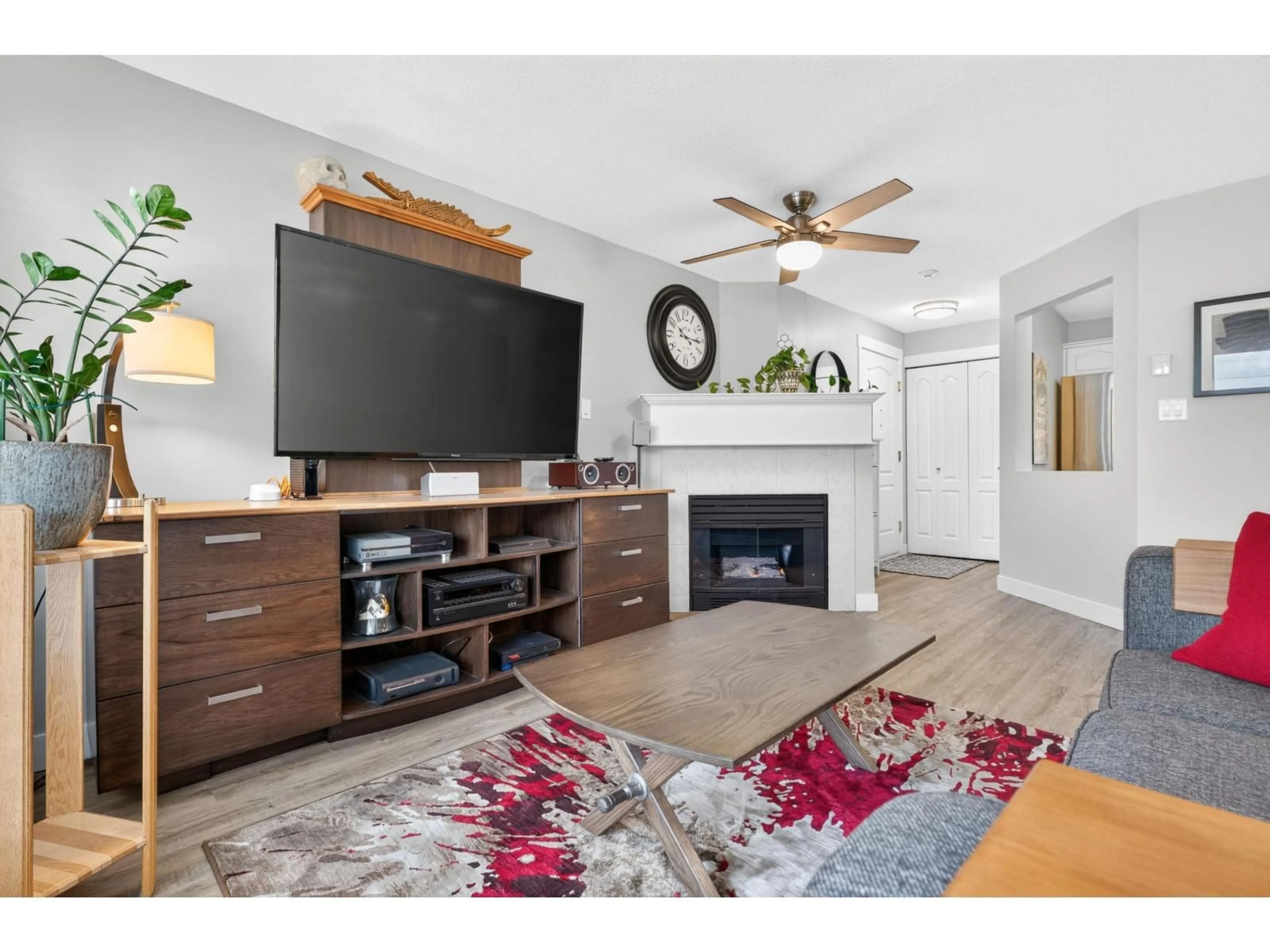 Living room with furniture, wood/laminate floor for 205 - 17730 58A AVENUE, Surrey British Columbia V3S8M5