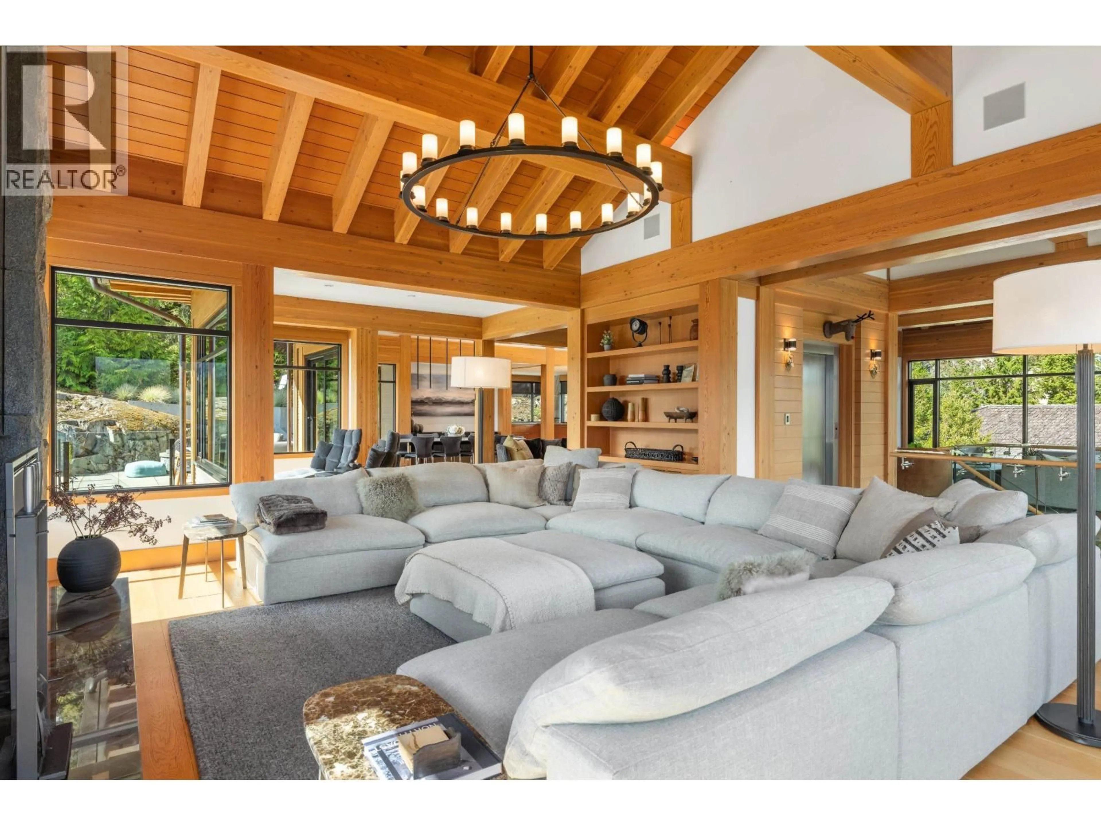 Living room with furniture, wood/laminate floor for 7465 TREETOP LANE, Whistler British Columbia V8E0E9