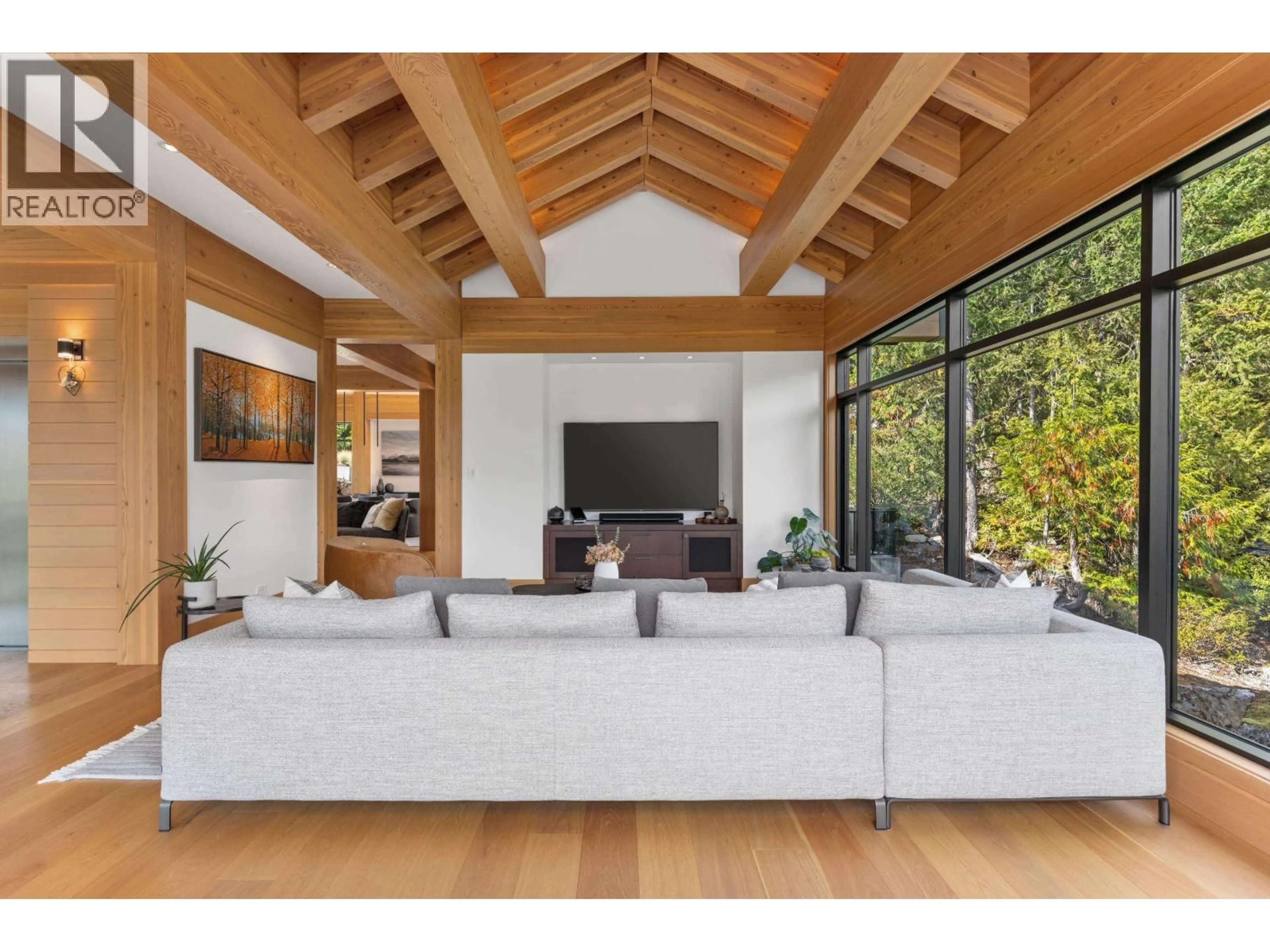 Living room with furniture, wood/laminate floor for 7465 TREETOP LANE, Whistler British Columbia V8E0E9