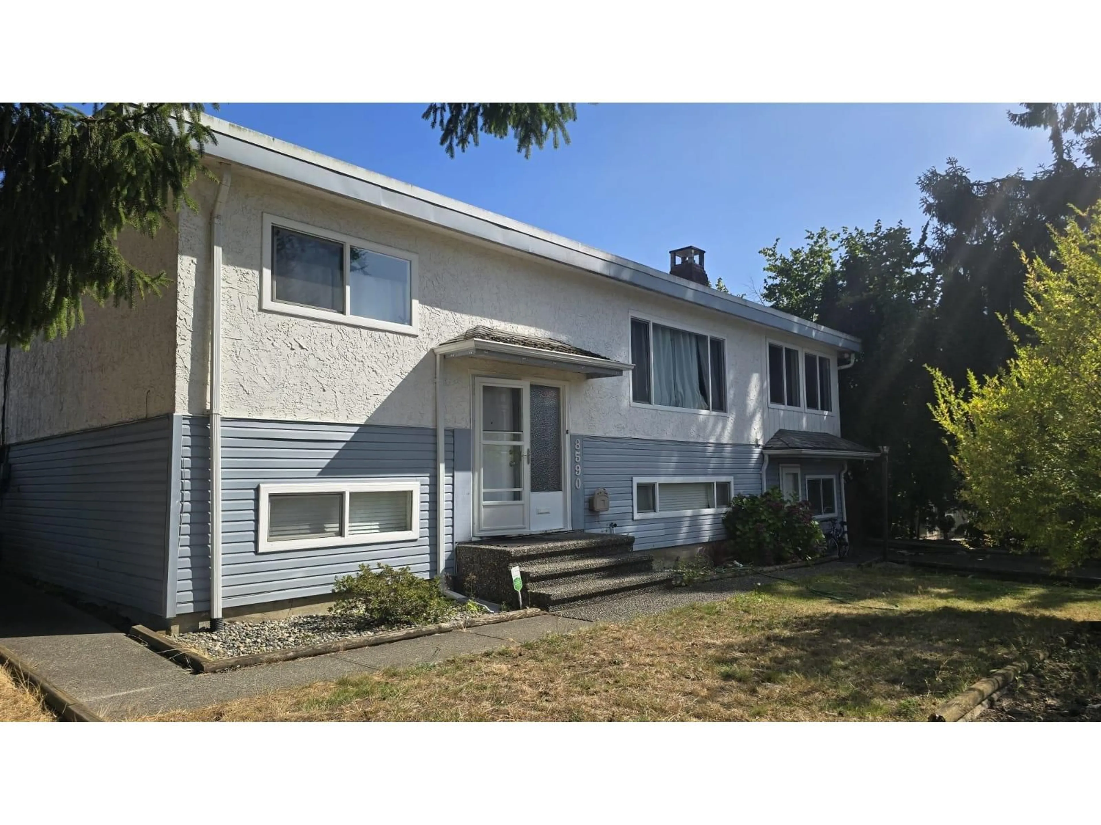 Home with vinyl exterior material, street for 8590 151A STREET, Surrey British Columbia V3S3J9