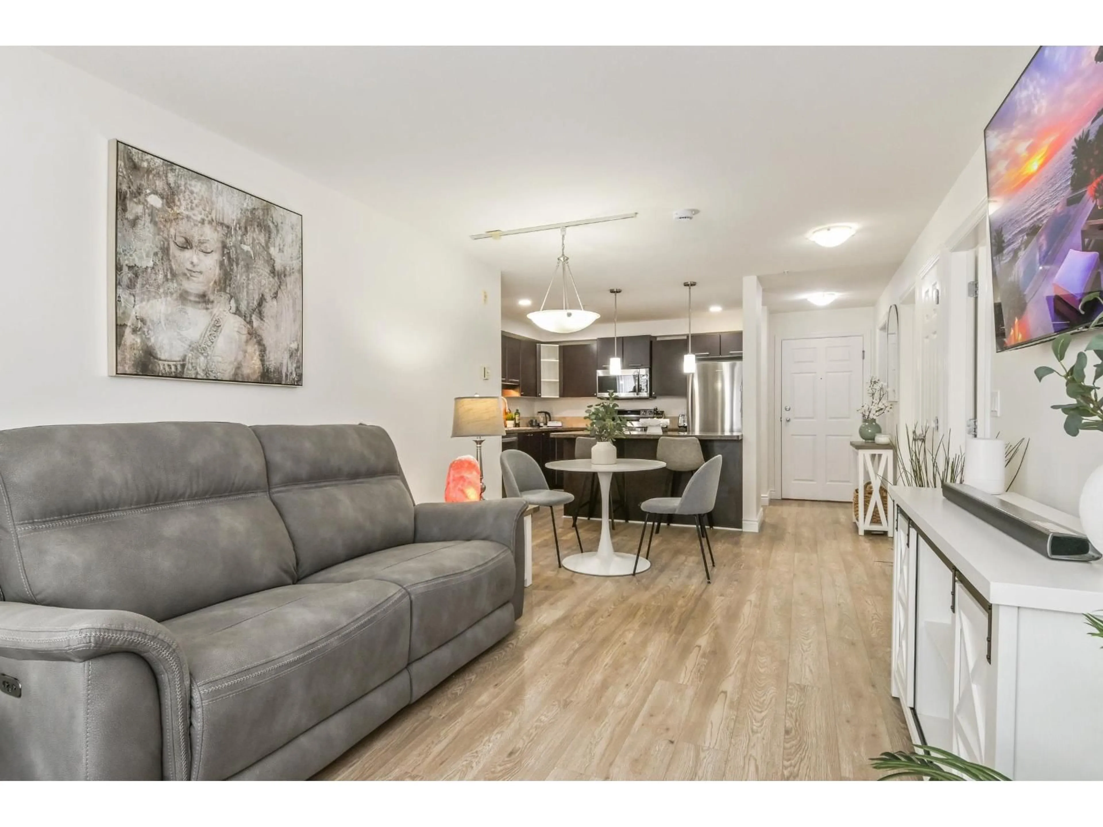 Living room with furniture, wood/laminate floor for 209 - 5454 198 STREET, Langley British Columbia V3A1G2
