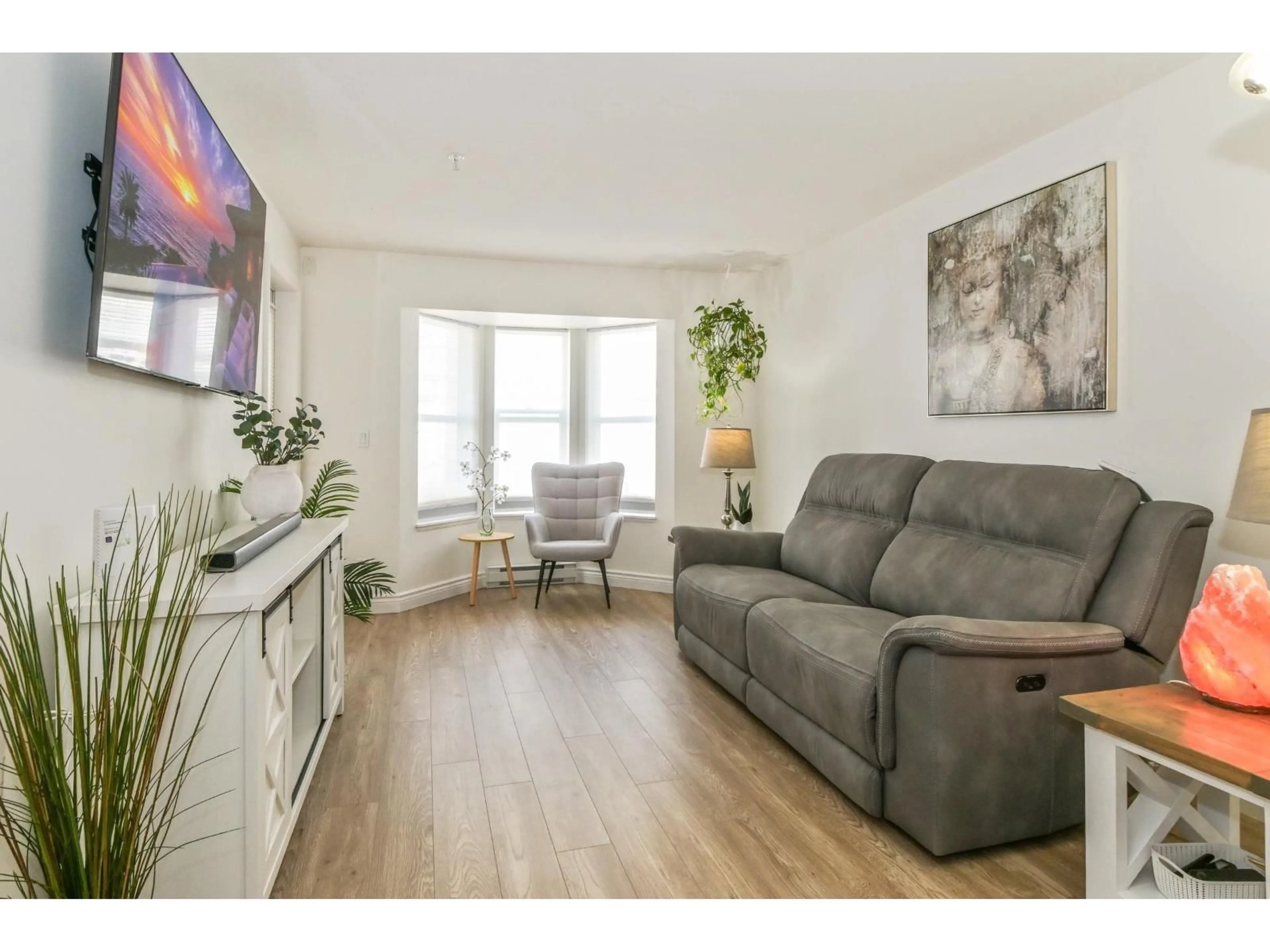 Living room with furniture, wood/laminate floor for 209 - 5454 198 STREET, Langley British Columbia V3A1G2