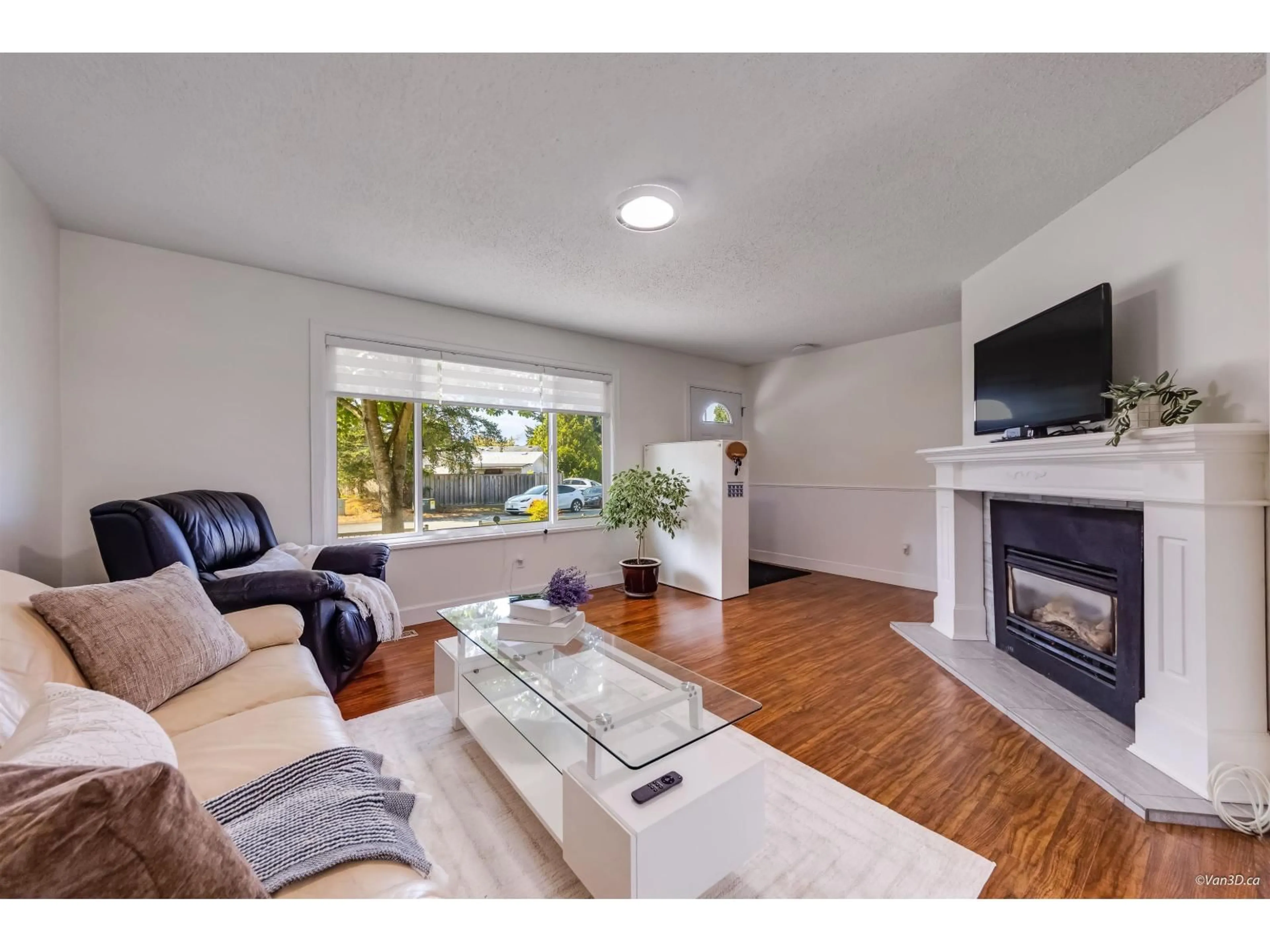 Living room with furniture, wood/laminate floor for 5052 205B STREET, Langley British Columbia V3A6Z5