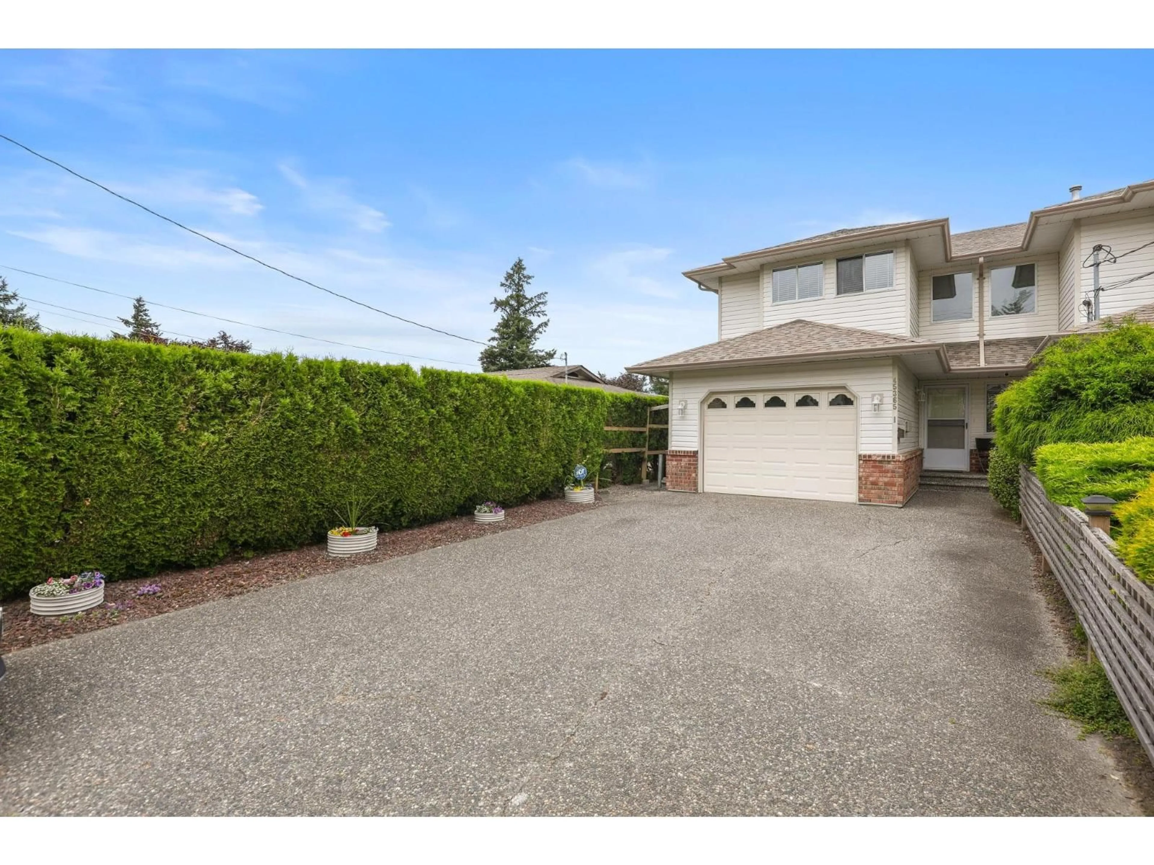 A pic from outside/outdoor area/front of a property/back of a property/a pic from drone, street for 1 - 45365 WATSON ROAD, Chilliwack British Columbia V2R2G6