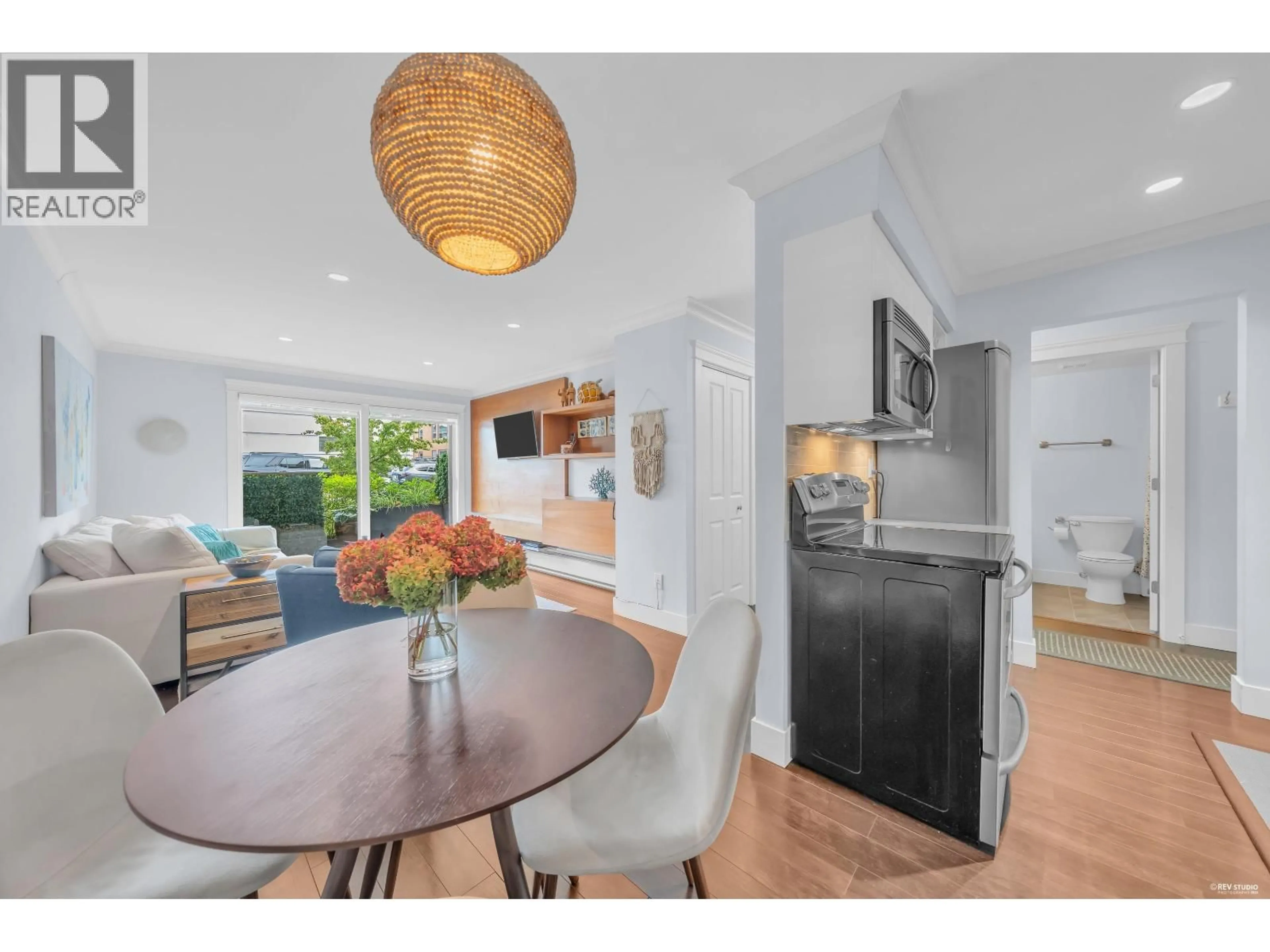 Open concept kitchen, wood/laminate floor for 111 - 2040 CORNWALL AVENUE, Vancouver British Columbia V6J1E1
