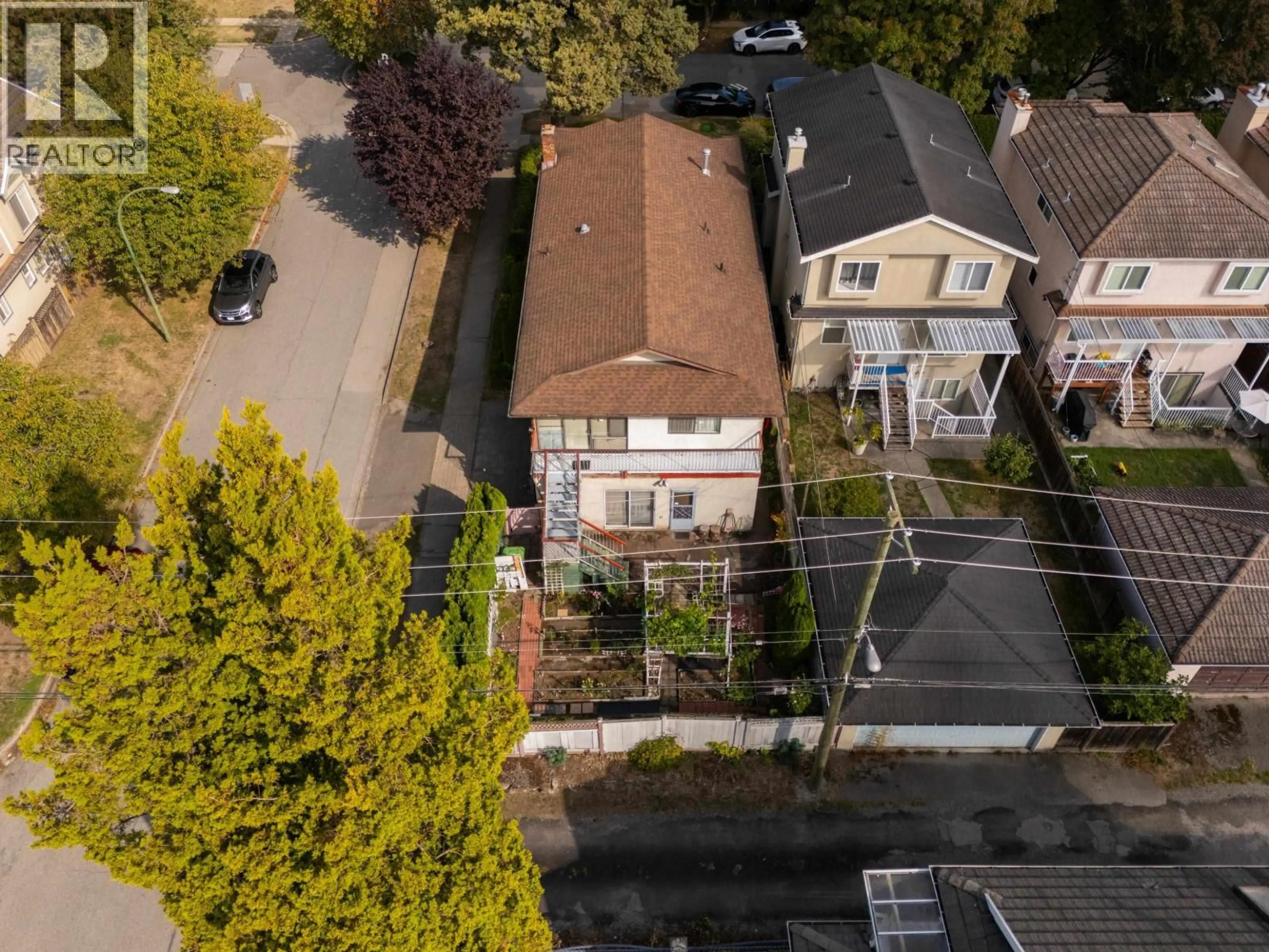 A pic from outside/outdoor area/front of a property/back of a property/a pic from drone, street for 1594 68TH AVENUE, Vancouver British Columbia V6P2V5