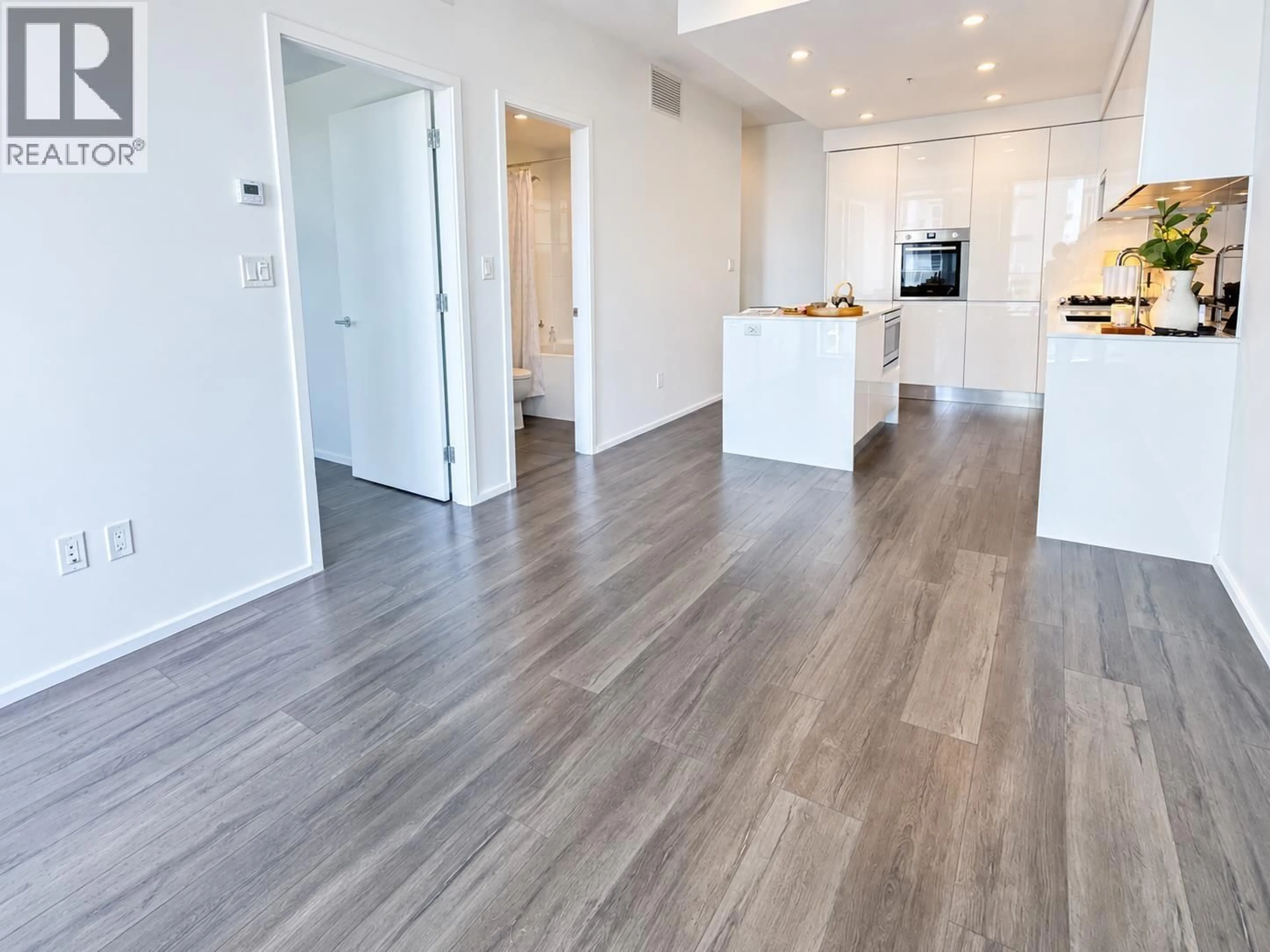 Open concept kitchen, wood/laminate floor for 1301 - 3888 EVERGREEN PLACE, Burnaby British Columbia V3J0M3