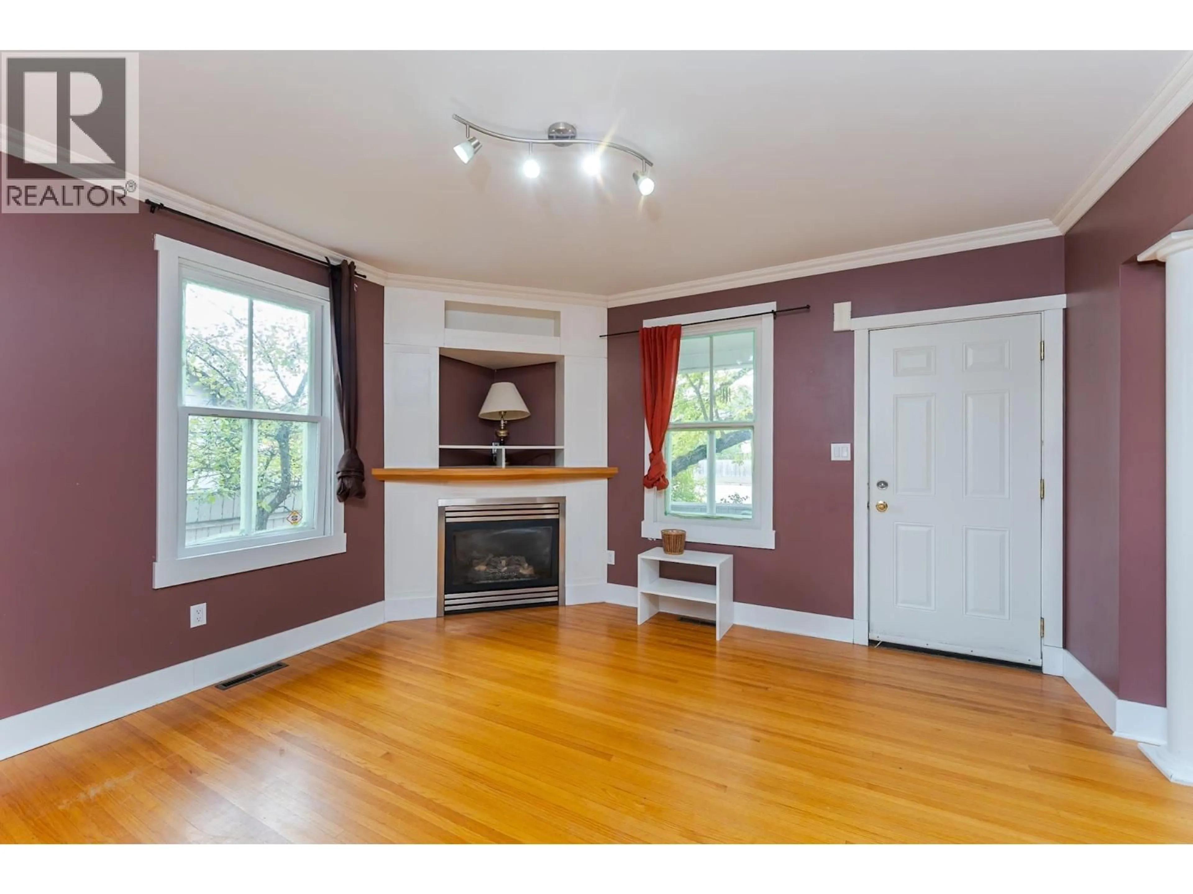 Living room with furniture, wood/laminate floor for 1684 5TH AVENUE, Prince George British Columbia V2L3M1