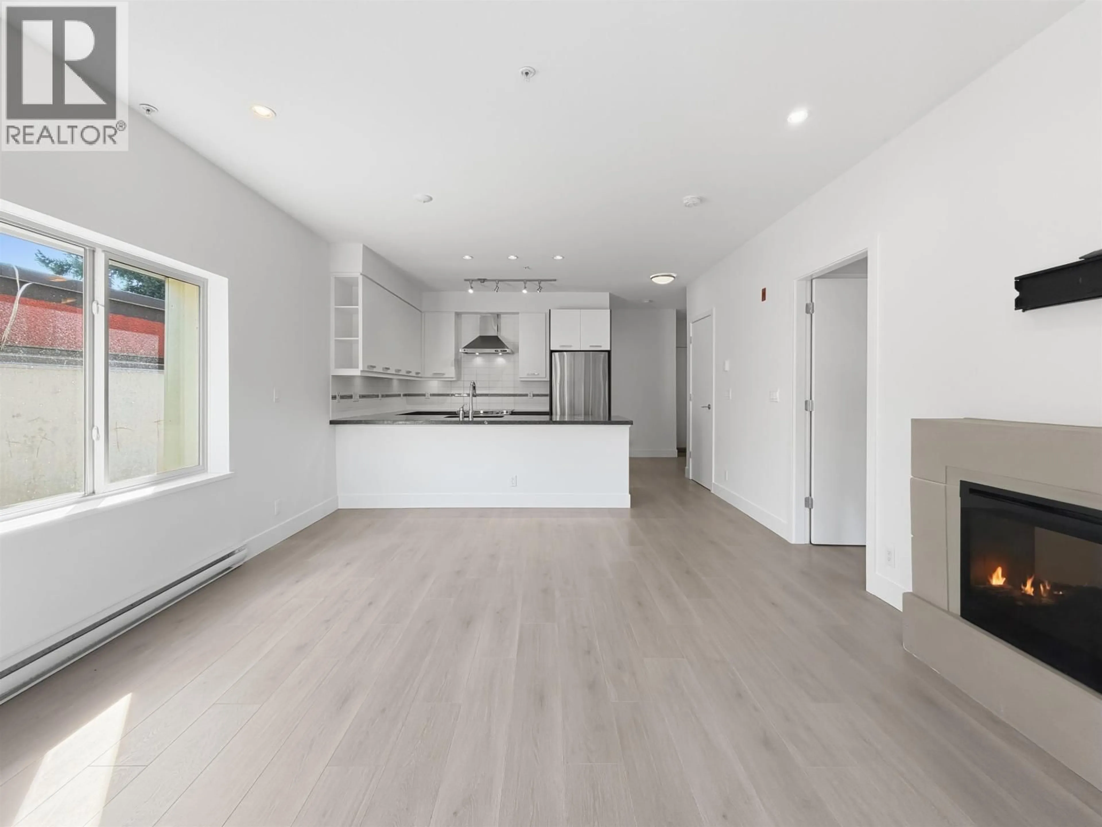Open concept kitchen, wood/laminate floor for 204 - 1273 MARINE DRIVE, North Vancouver British Columbia V7P1T3