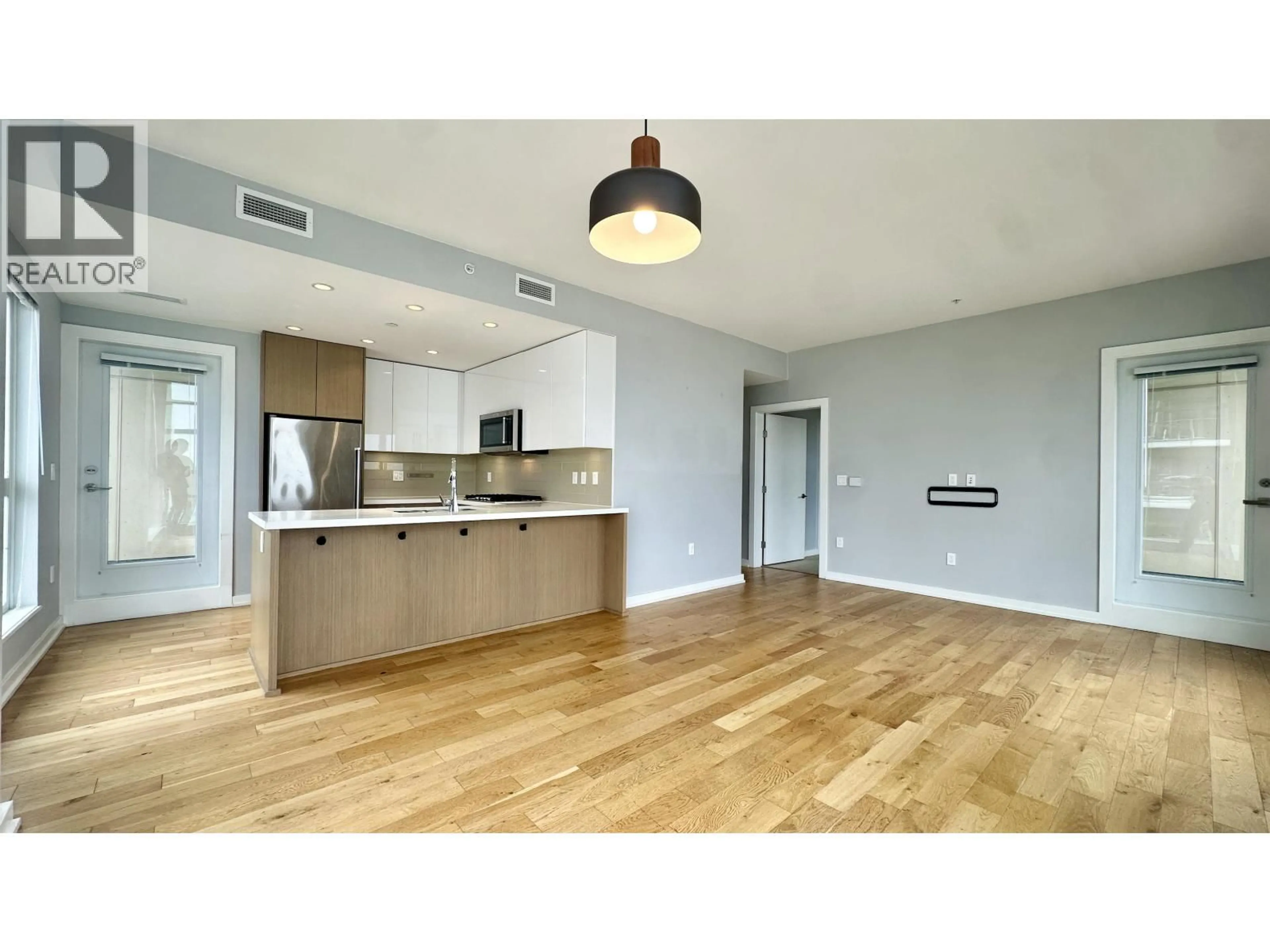 Open concept kitchen, wood/laminate floor for 208 - 5311 CEDARBRIDGE WAY, Richmond British Columbia V6X0M3