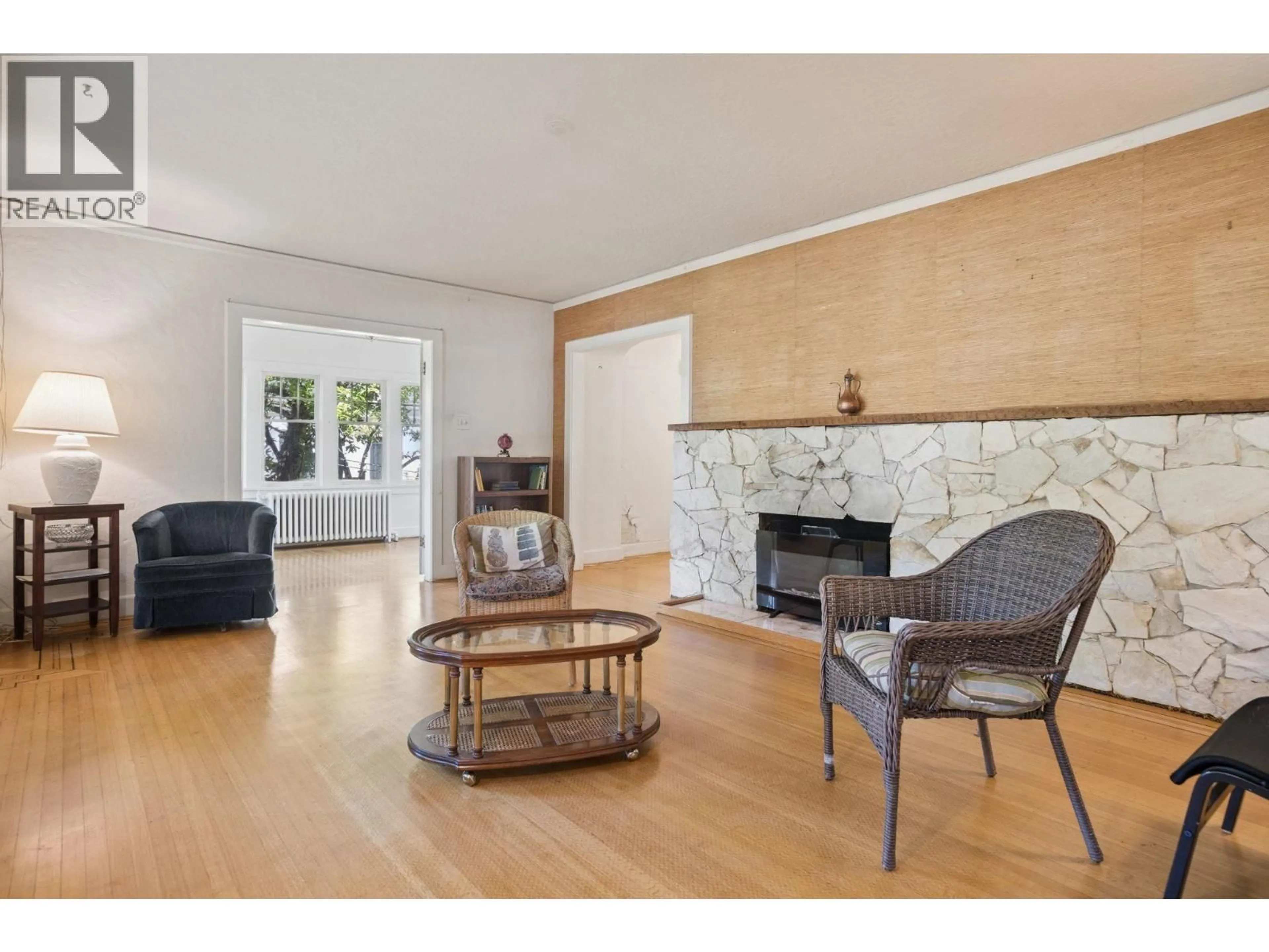 Living room with furniture, wood/laminate floor for 1844 ACADIA ROAD, Vancouver British Columbia V6T1R3