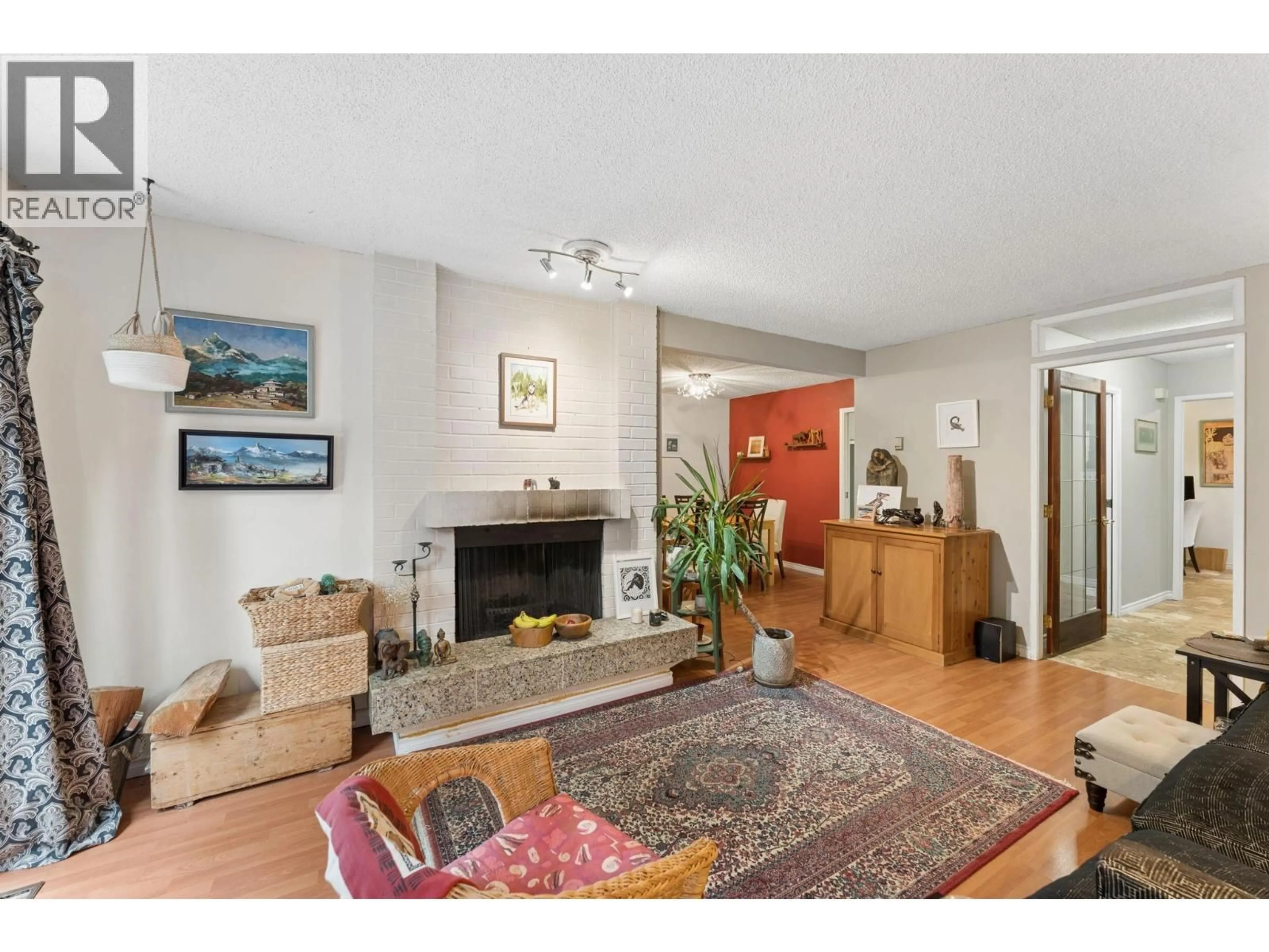 Living room with furniture, wood/laminate floor for 834 HENDECOURT ROAD, North Vancouver British Columbia V7K2Y2