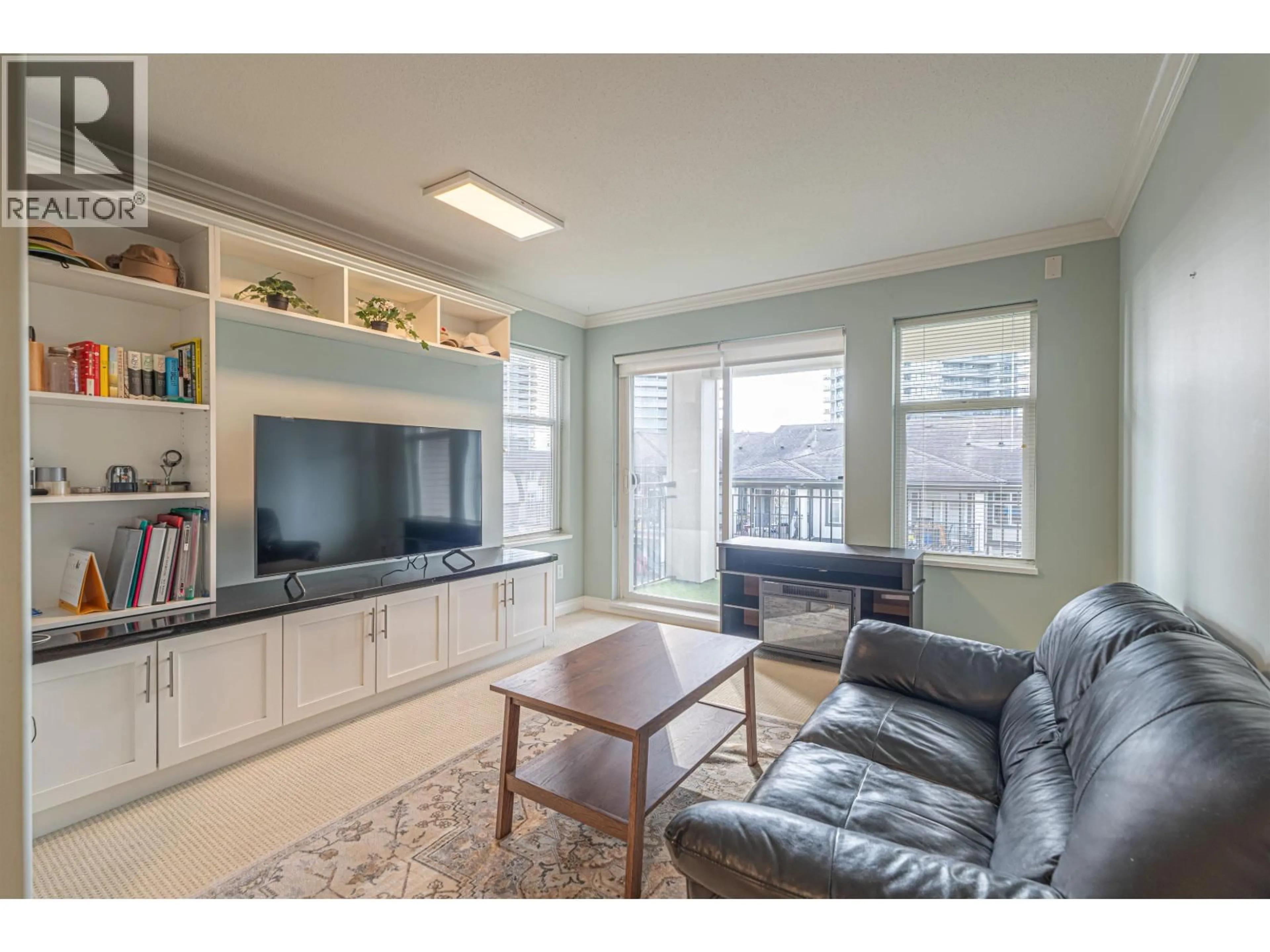 Living room with furniture, wood/laminate floor for 303 - 4799 BRENTWOOD DRIVE, Burnaby British Columbia V5C0C4