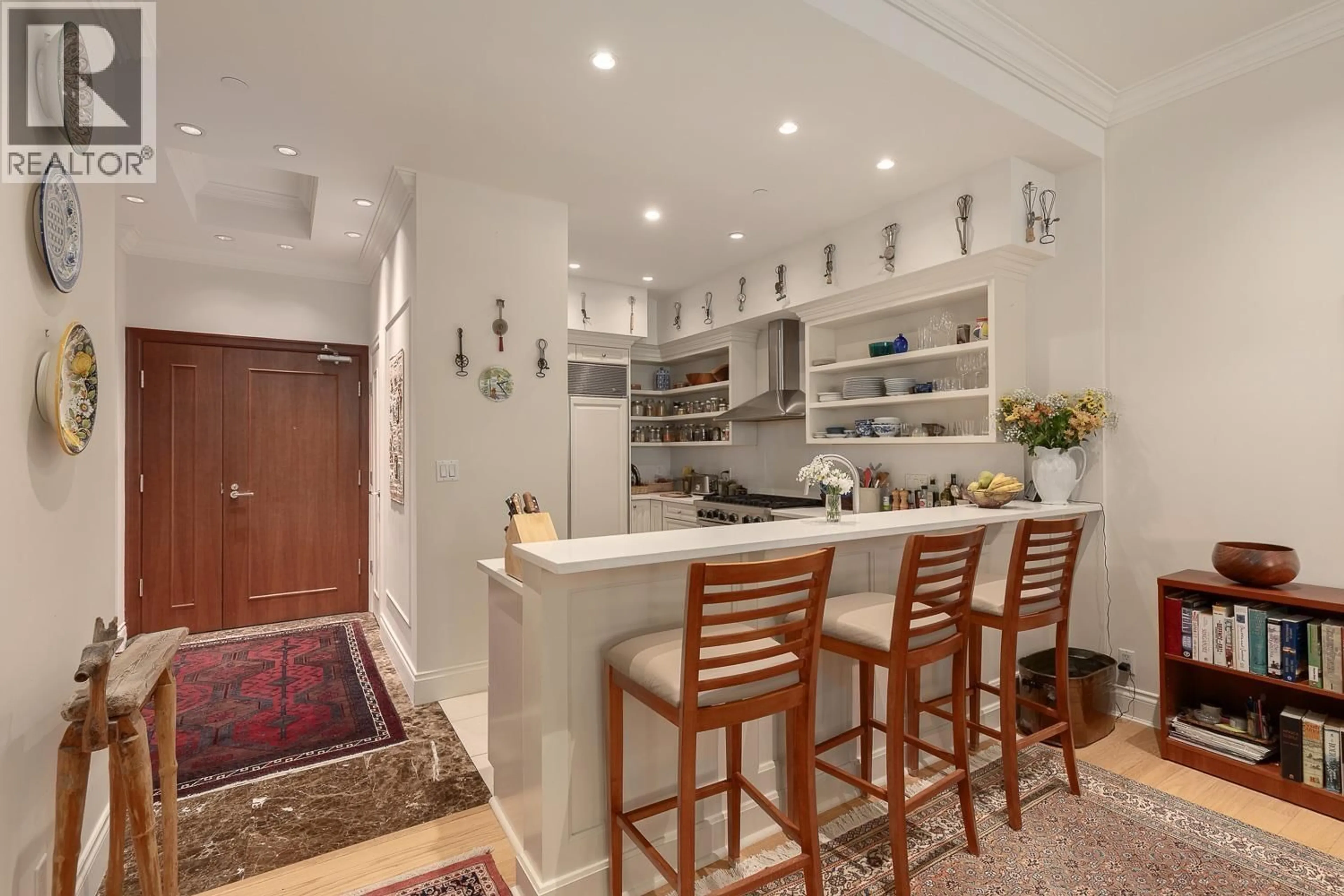 Open concept kitchen, ceramic/tile floor for 101 - 426 BEACH CRESCENT, Vancouver British Columbia V6Z3E9