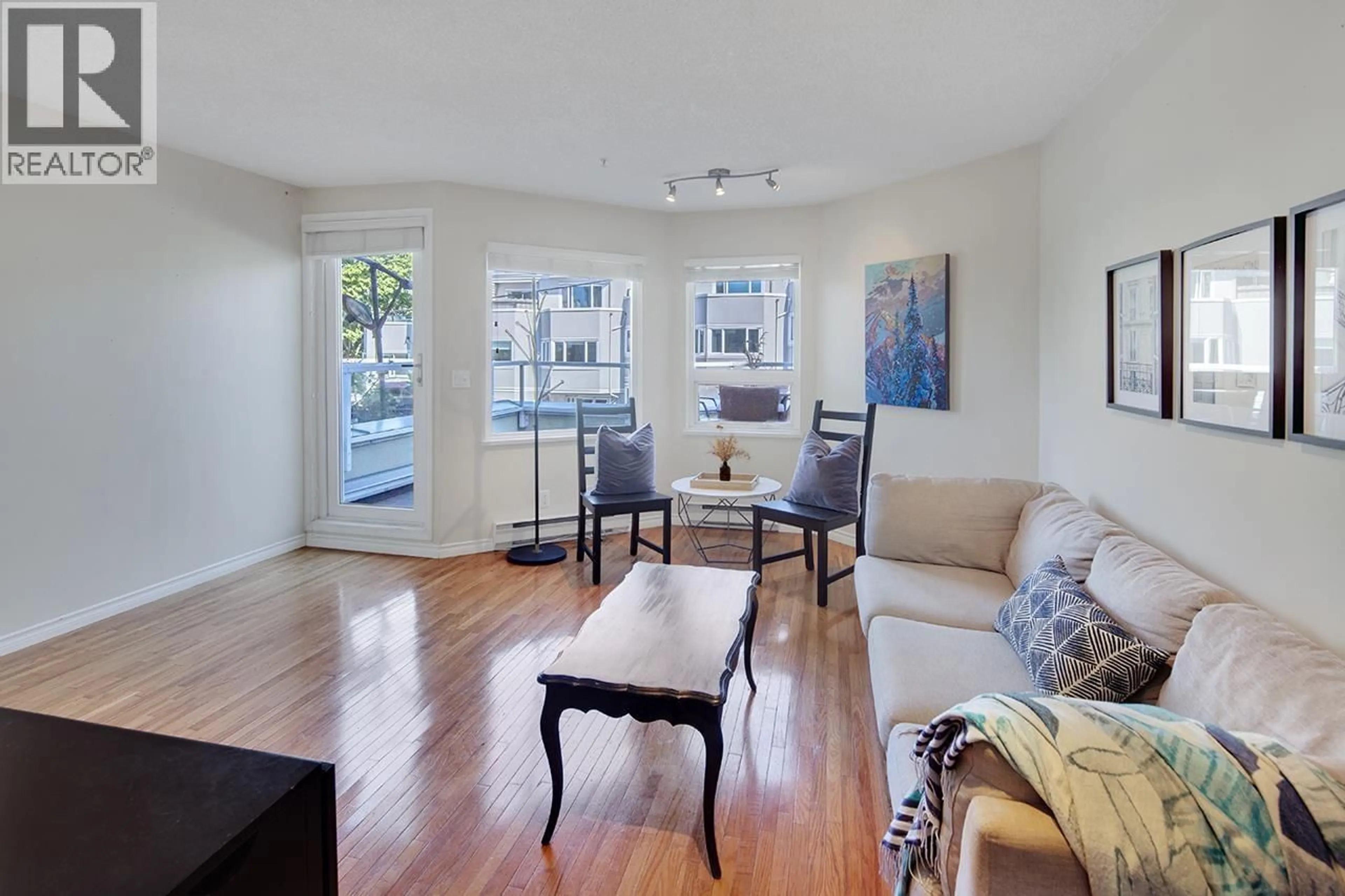 Living room with furniture, wood/laminate floor for 1210 7TH AVENUE, Vancouver British Columbia V6H1B6