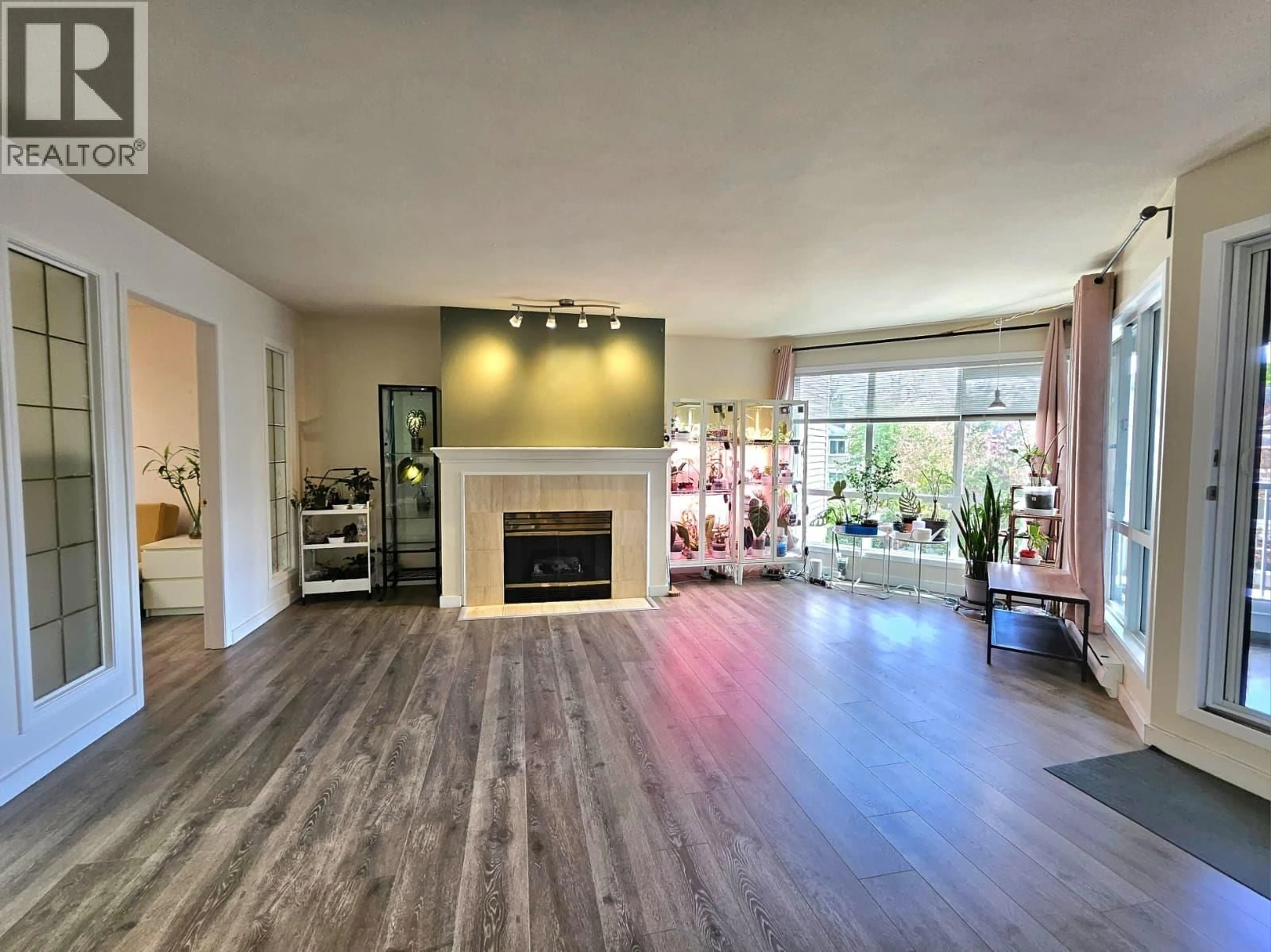 Living room with furniture, wood/laminate floor for 311 - 7437 MOFFATT ROAD, Richmond British Columbia V6Y3V9