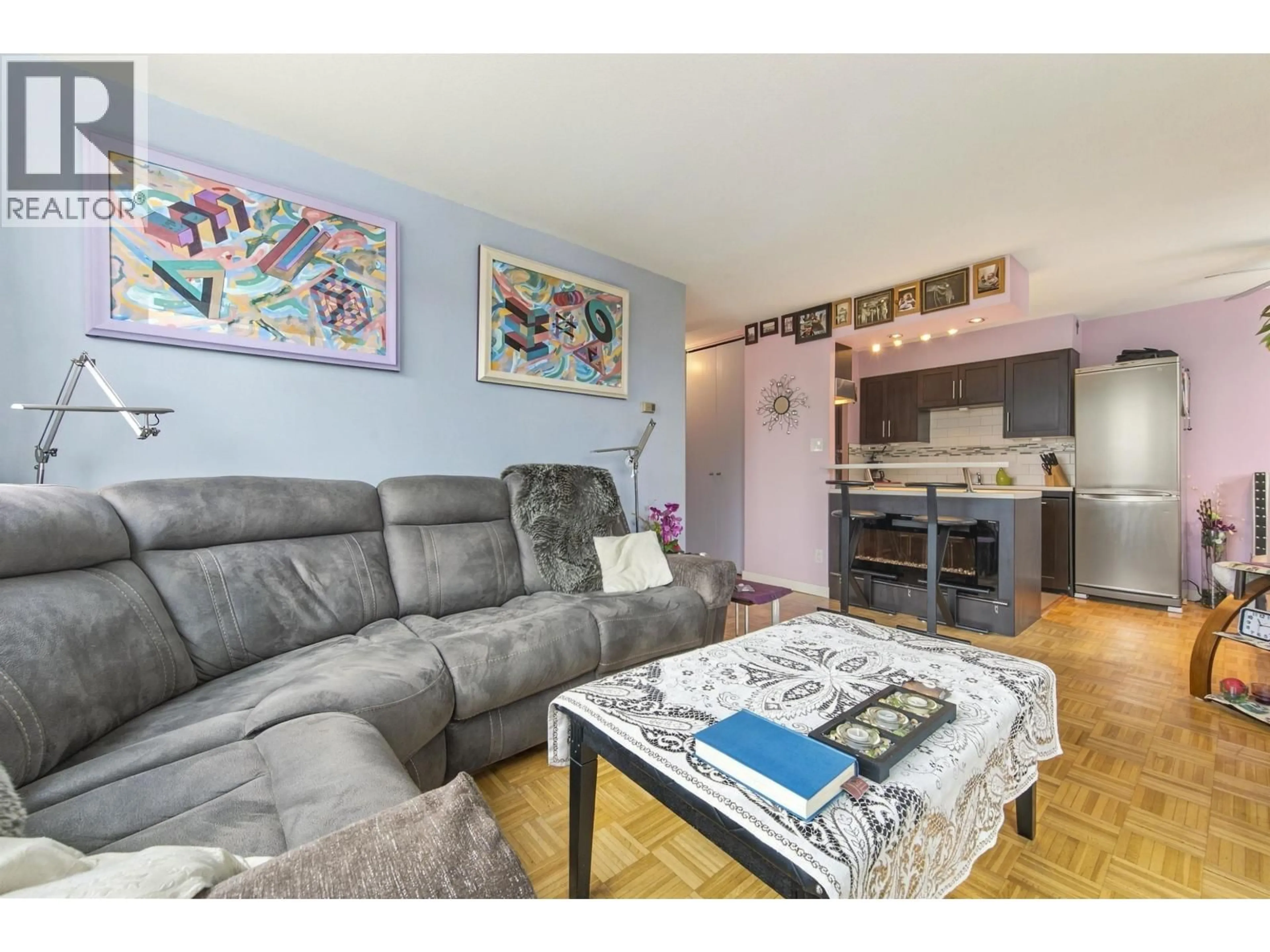 Living room with furniture, wood/laminate floor for 705 - 1251 CARDERO STREET, Vancouver British Columbia V6G2H9