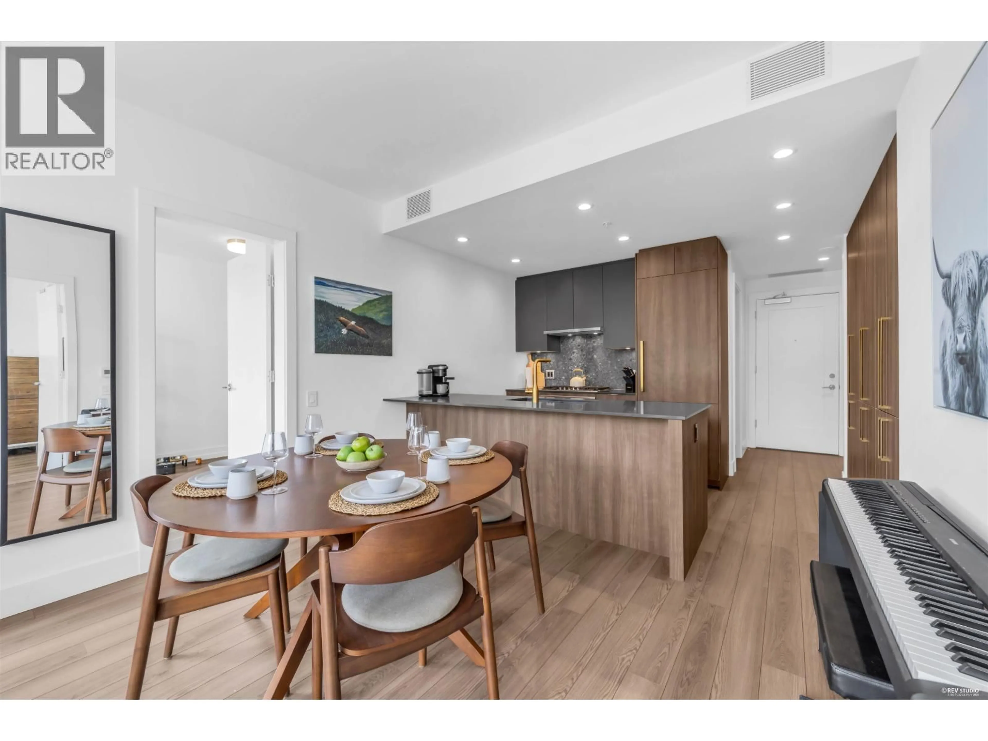 Open concept kitchen, wood/laminate floor for 704 - 2375 EMERY COURT, North Vancouver British Columbia V7J0E8