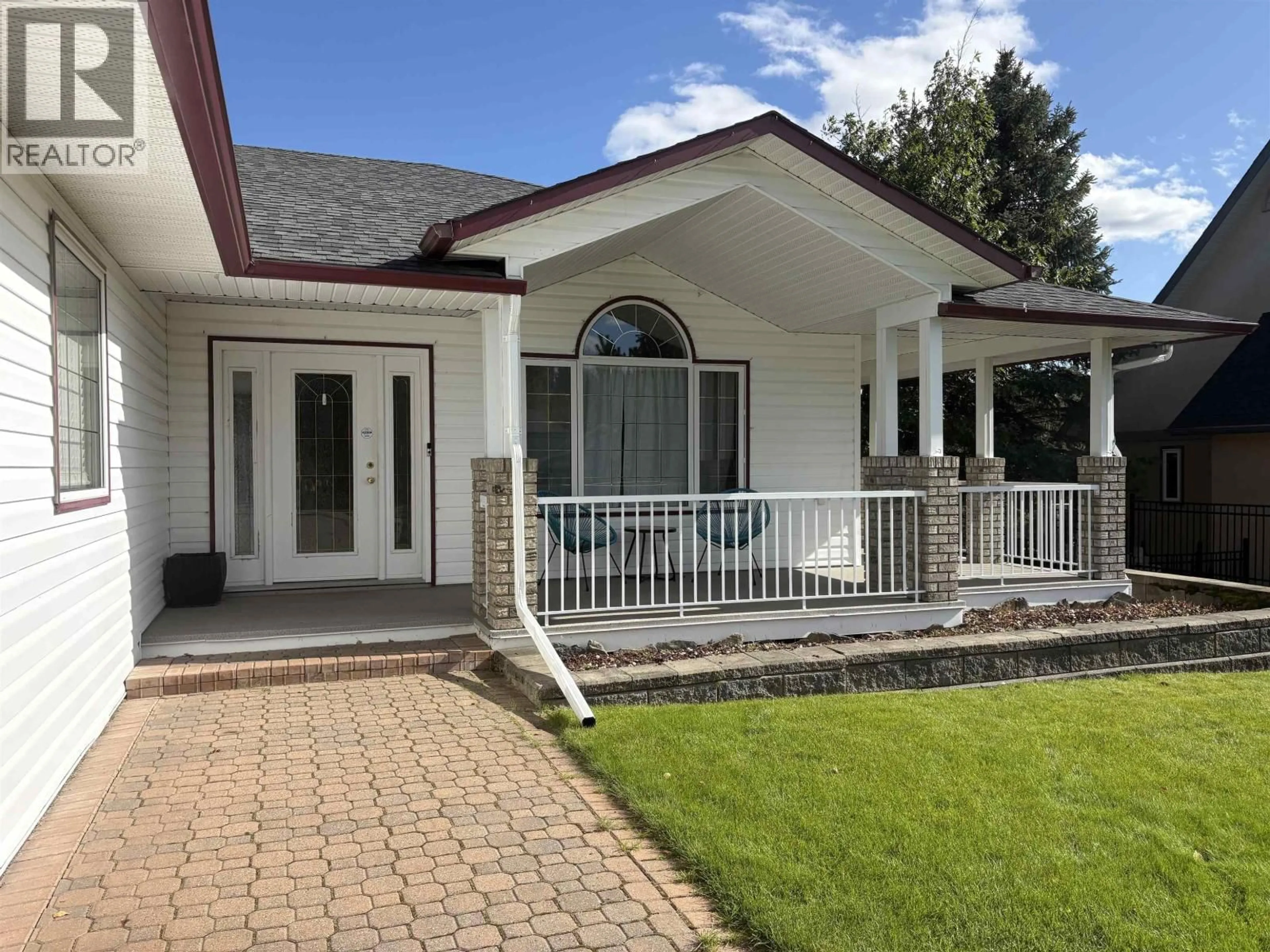 Home with vinyl exterior material, street for 2362 MCTAVISH ROAD, Prince George British Columbia V2K5R5