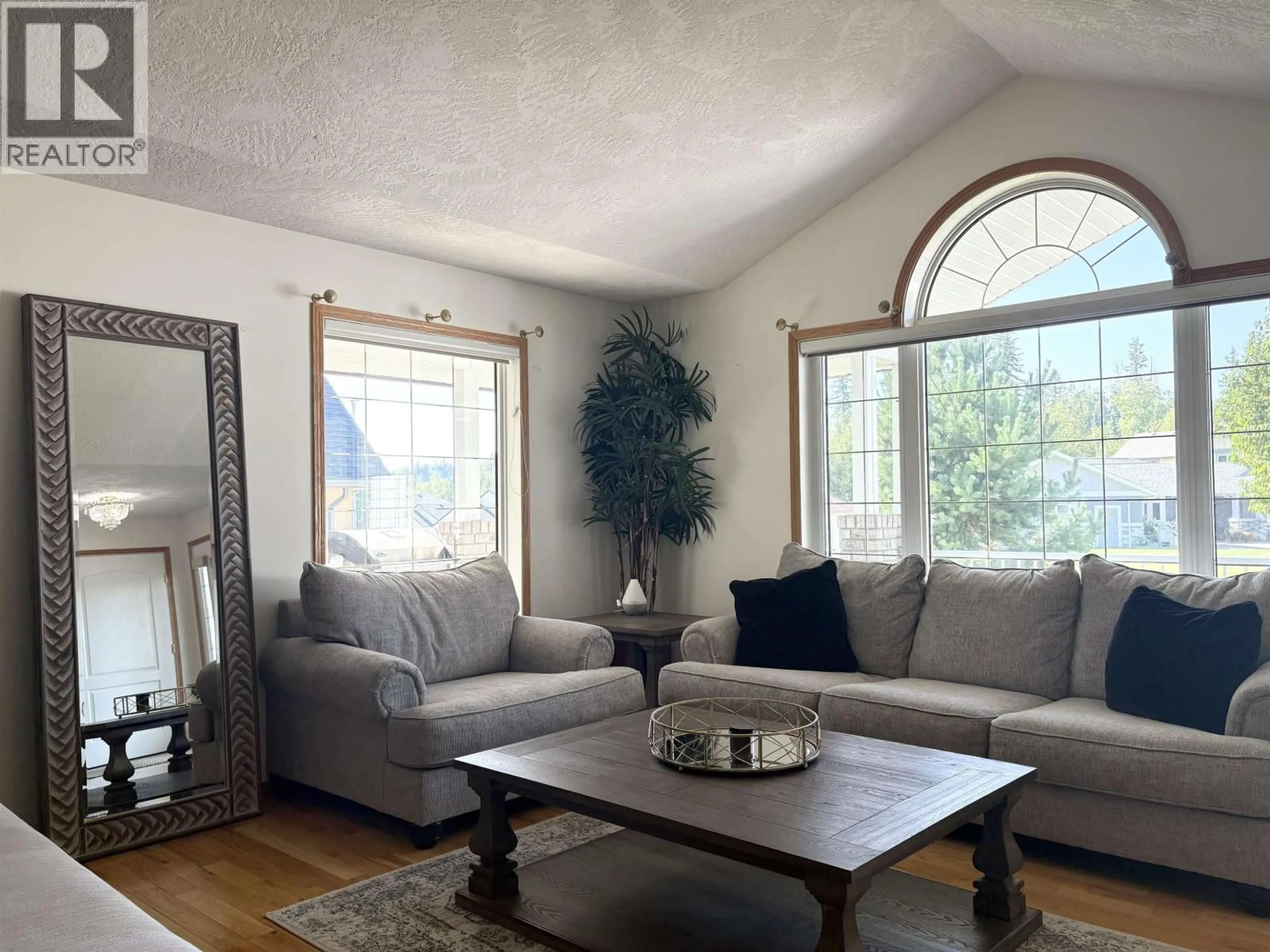 Living room with furniture, wood/laminate floor for 2362 MCTAVISH ROAD, Prince George British Columbia V2K5R5